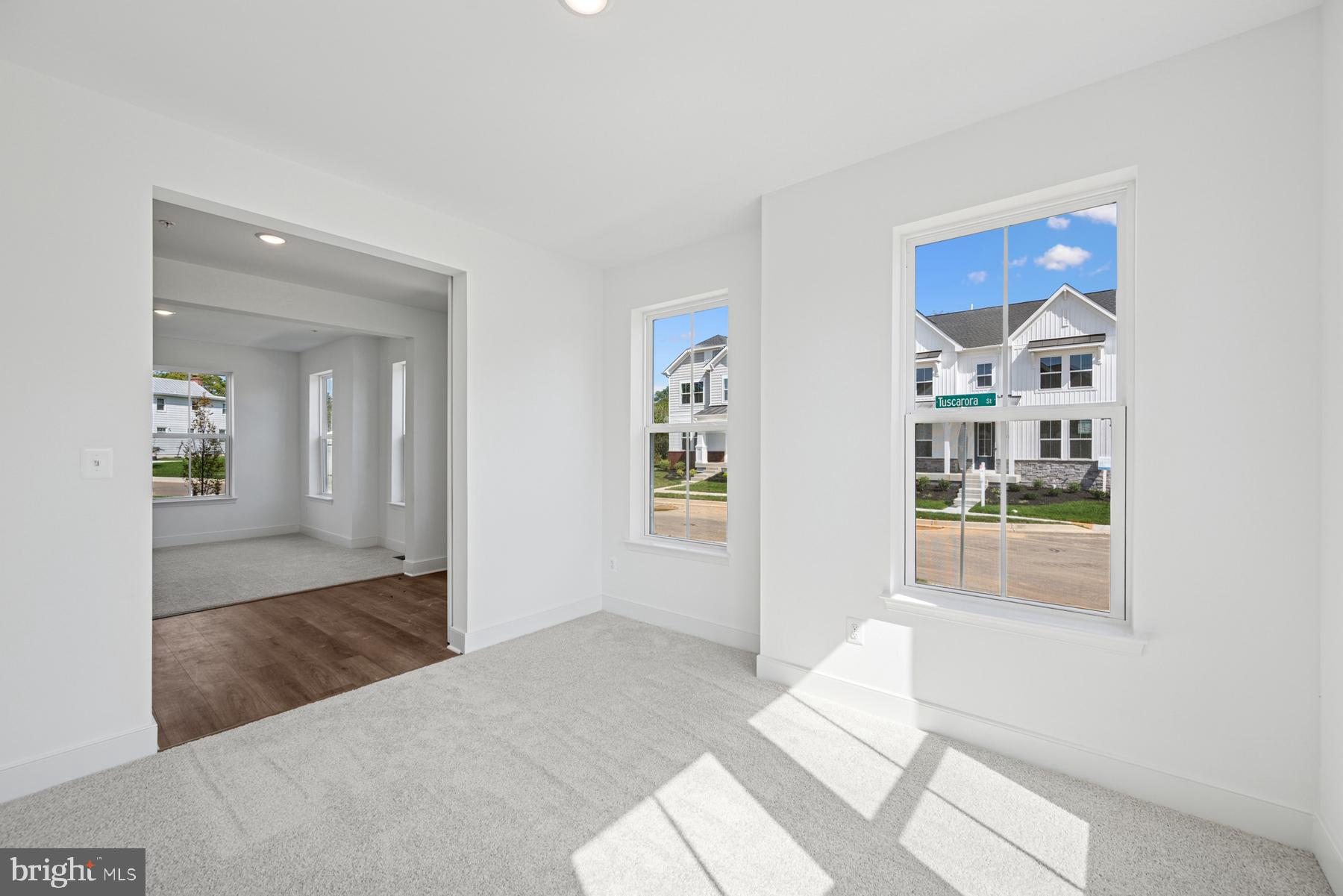 2730 Tuscarora Road Adamstown, MD 21710 - Photo 34 of 37 a bedroom with a large bed and a chandelier