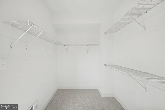 a view of a room with racks on the wall