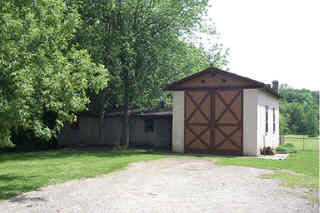 5594 Cunningham Road Rockford, IL 61102 - Photo 1 of 5 a front view of a house with garden