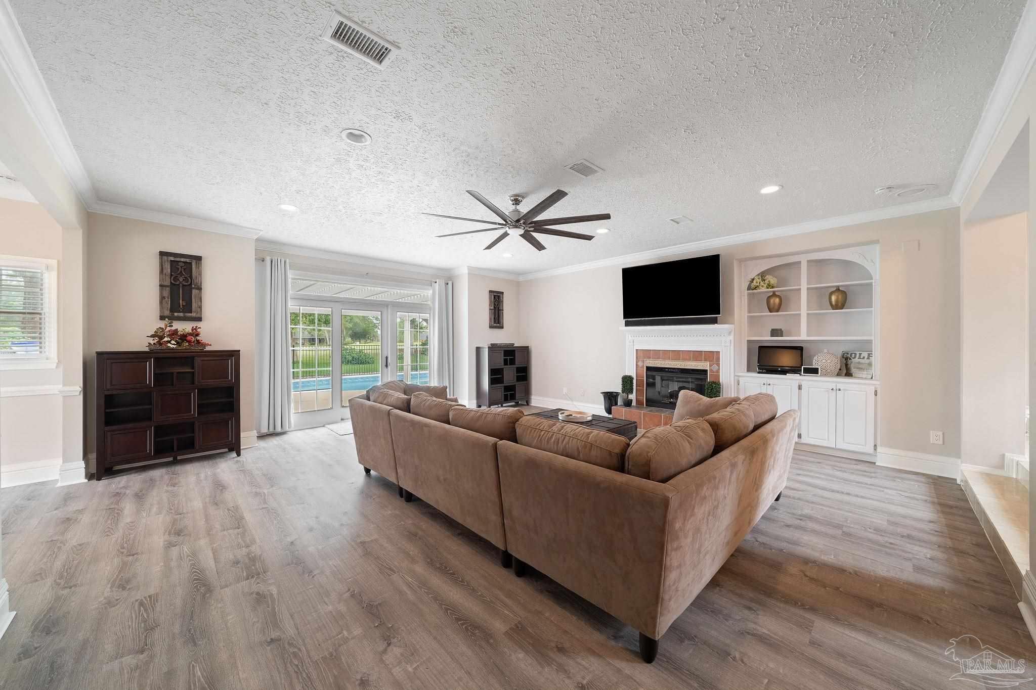 5631 Ballybunion Drive Pace, FL 32571 - Photo 6 of 43 Gas Fireplace and Built In Bookshelves