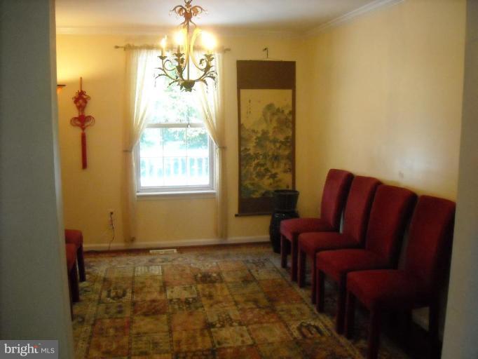 8612 Daytona Road Rosedale, MD 21237 - Photo 5 of 23 a living room with furniture and a chandelier