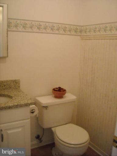 8612 Daytona Road Rosedale, MD 21237 - Photo 8 of 23 a white toilet sitting next to a shower