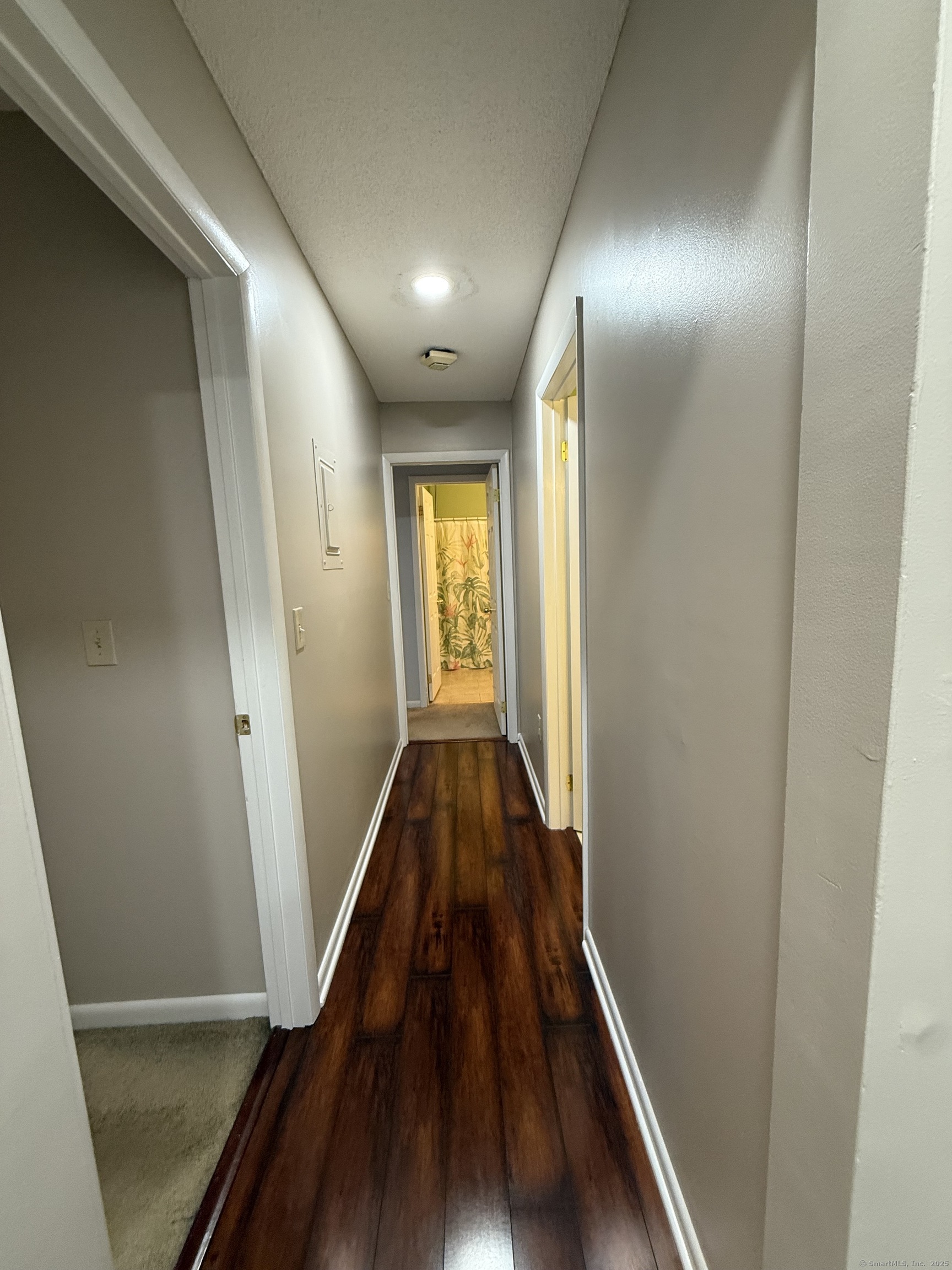 175 Mill Pond Road, Unit 215 Hamden, CT 06514 - Photo 7 of 19 a view of hallway with wooden floor