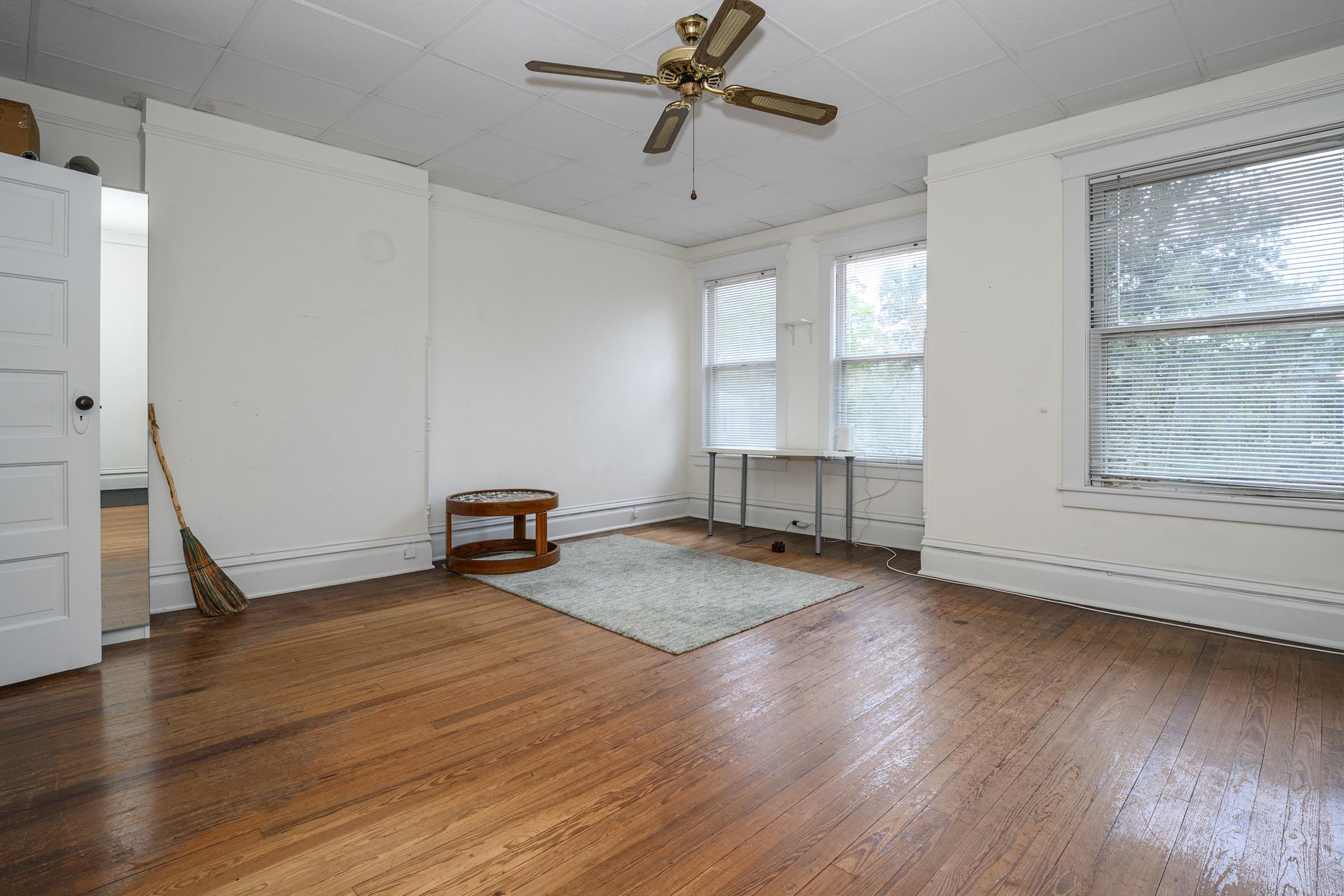 24 Saragossa Street St. Augustine, FL 32084 - Photo 66 of 99 a view of empty room with wooden floor and fan
