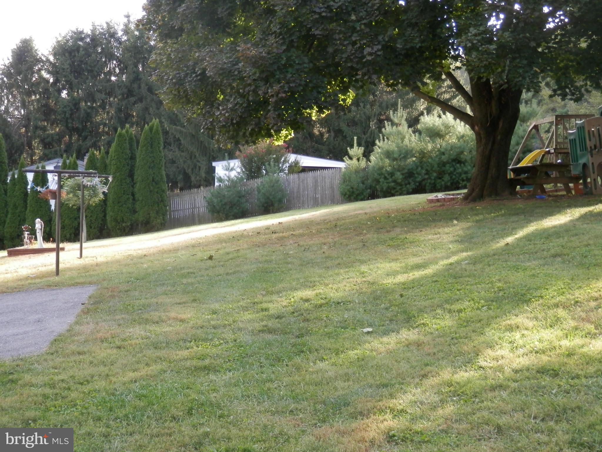 3612 Lineboro Road Manchester, MD 21102 - Photo 6 of 7 a backyard of a house with lots of green space