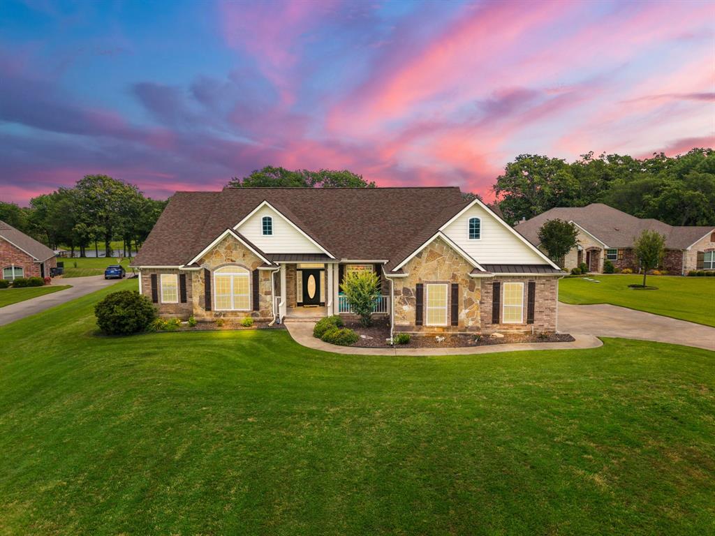 345 Rains County Road 3390 Emory, TX 75440 - Photo 1 of 39 a front view of a house with a yard
