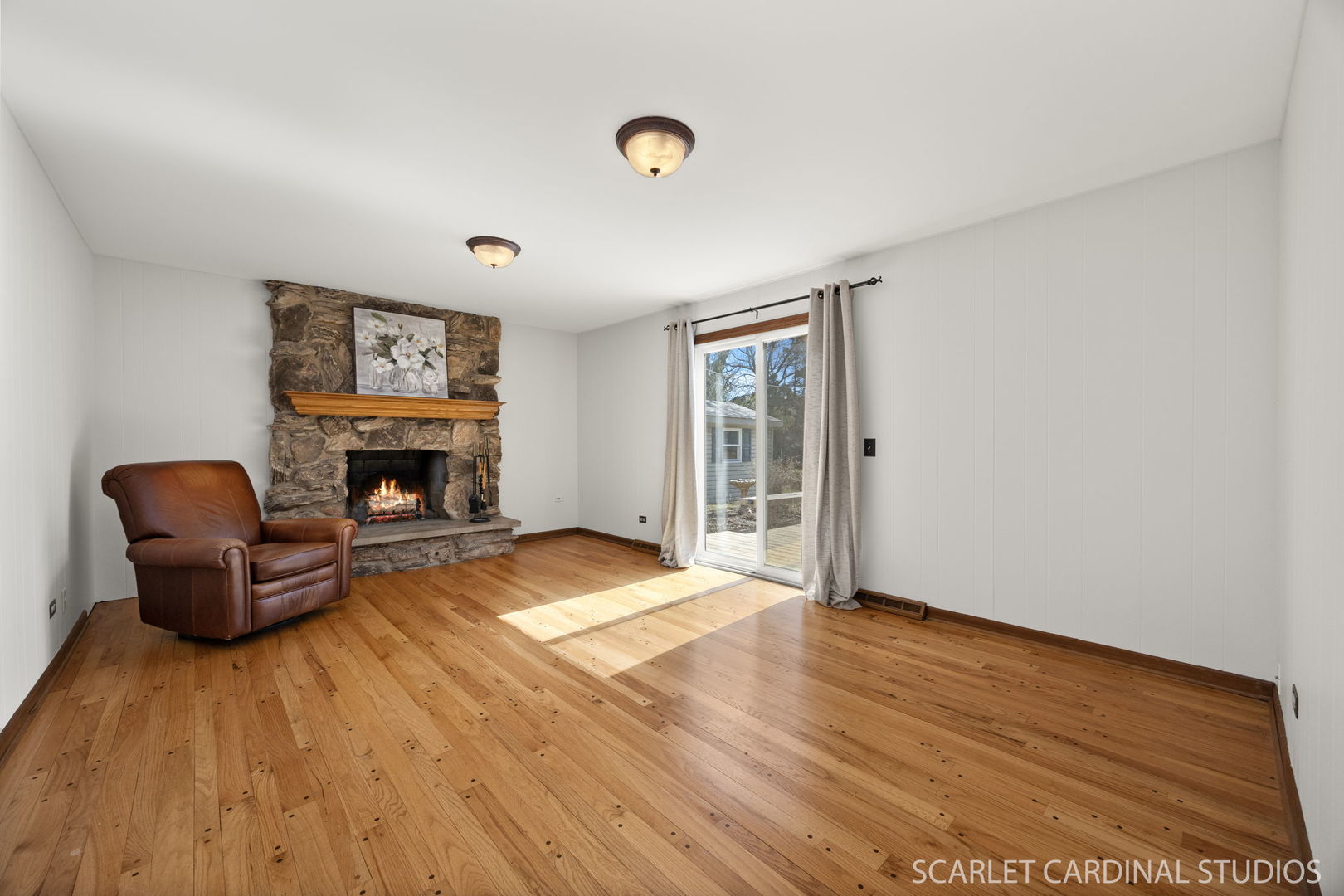 26W275 Tomahawk Drive Wheaton, IL 60189 - Photo 12 of 41 a living room with furniture and a fireplace