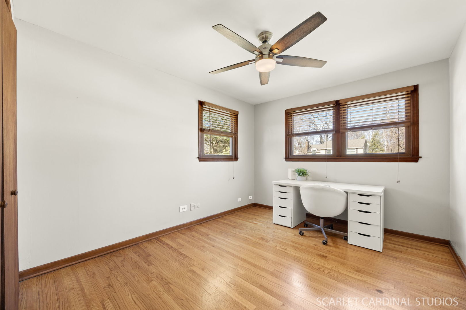 26W275 Tomahawk Drive Wheaton, IL 60189 - Photo 18 of 41 a view of a workspace with wooden floor and a window
