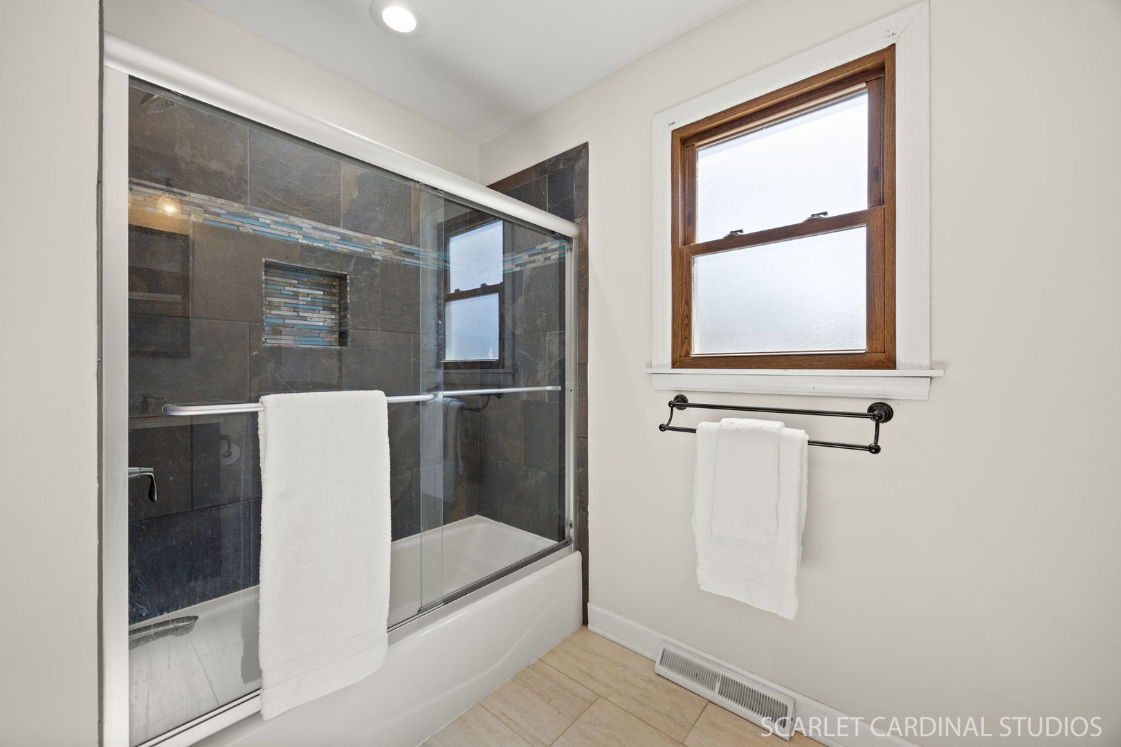 26W275 Tomahawk Drive Wheaton, IL 60189 - Photo 20 of 41 a bathroom with a bathtub and shower