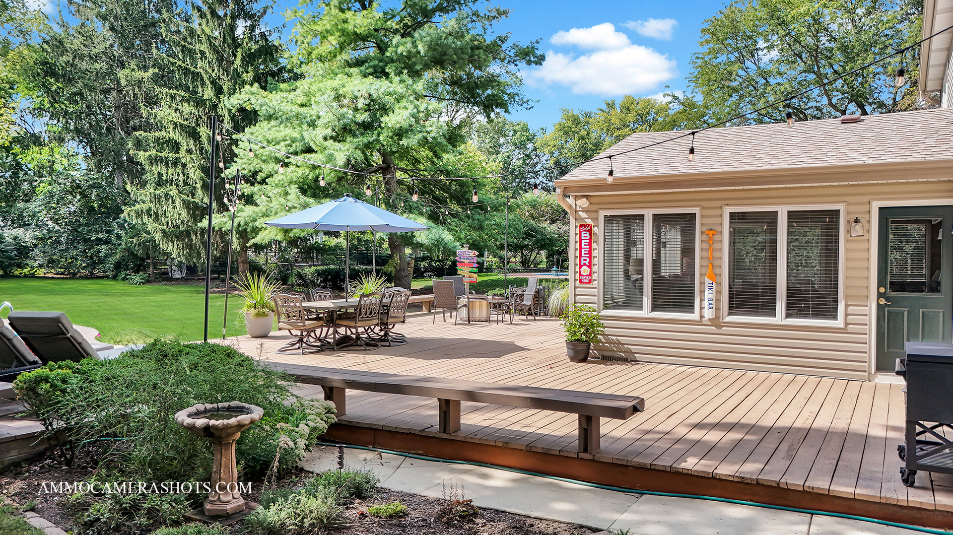 26W275 Tomahawk Drive Wheaton, IL 60189 - Photo 26 of 41 a view of a patio with table and chairs potted plants and a large tree