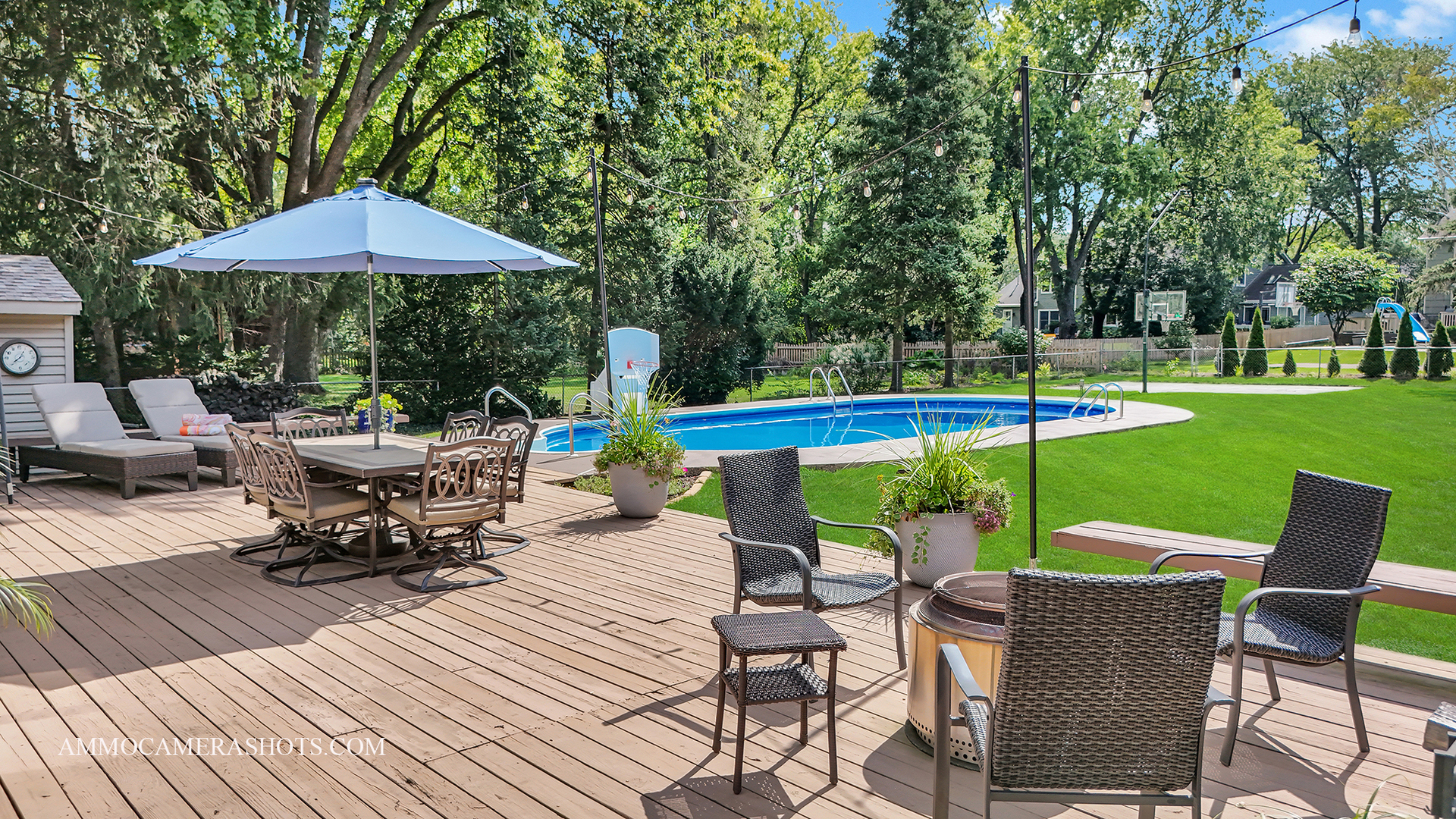 26W275 Tomahawk Drive Wheaton, IL 60189 - Photo 27 of 41 a view of a table and chairs under an umbrella