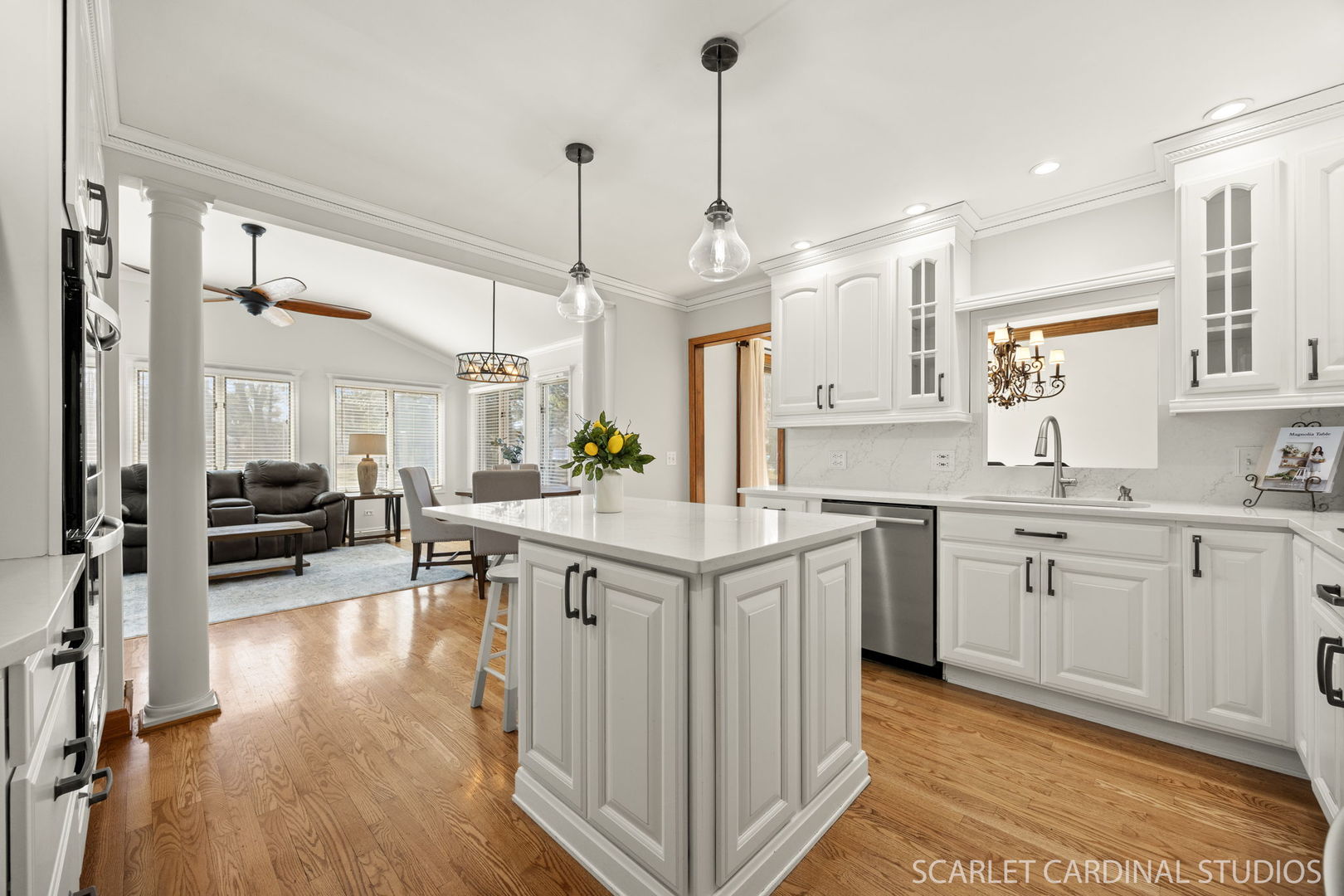 26W275 Tomahawk Drive Wheaton, IL 60189 - Photo 5 of 41 a kitchen with stainless steel appliances granite countertop a lot of counter space and wooden floors