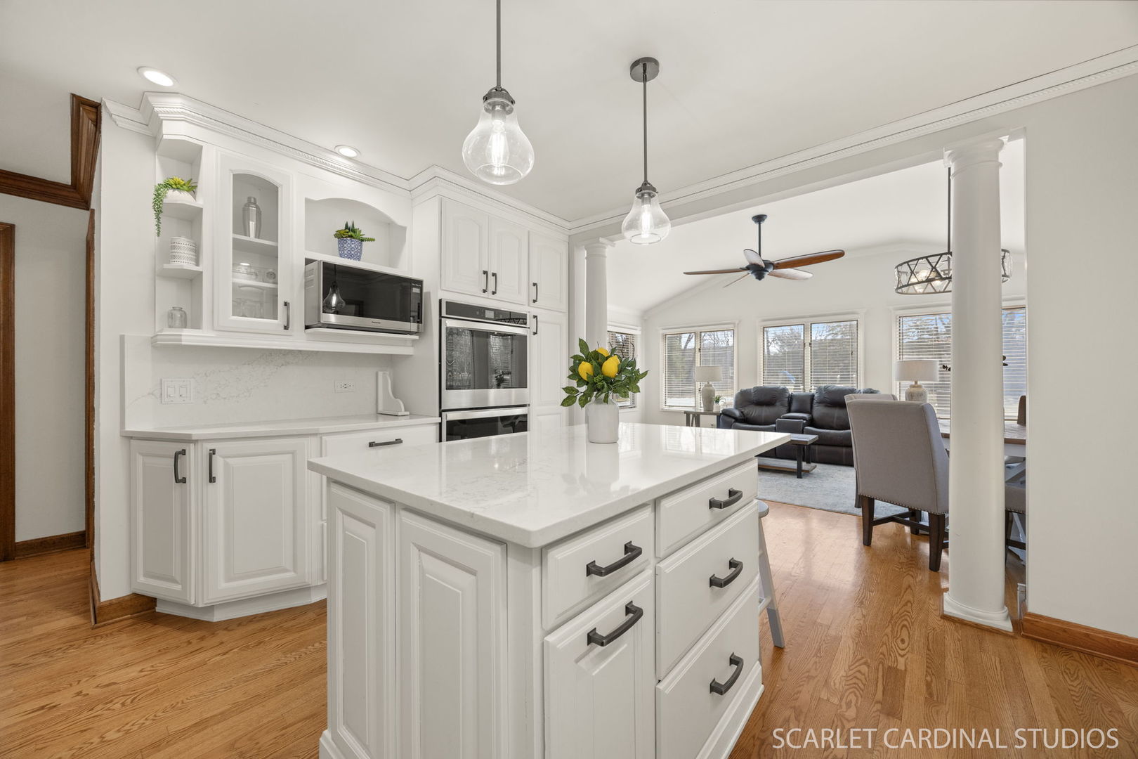 26W275 Tomahawk Drive Wheaton, IL 60189 - Photo 7 of 41 a kitchen with stainless steel appliances kitchen island granite countertop a sink and refrigerator