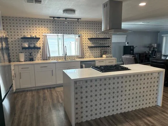 a kitchen with a sink and cabinets