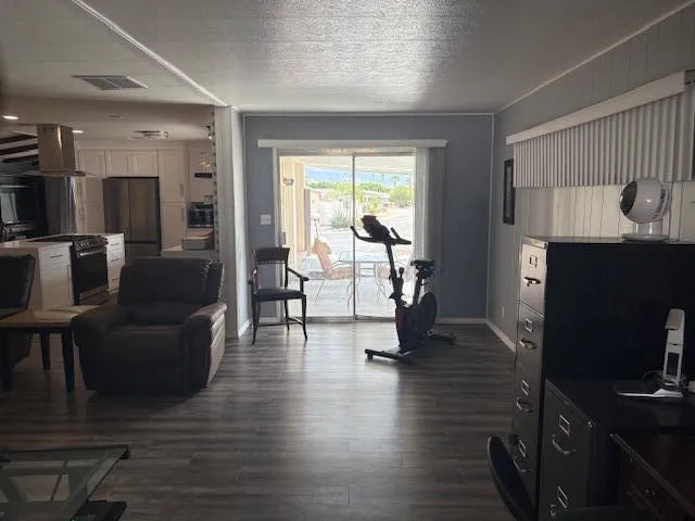 a living room with fireplace furniture and a flat screen tv