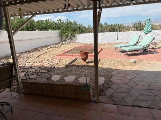 a view of a roof deck with a barbeque