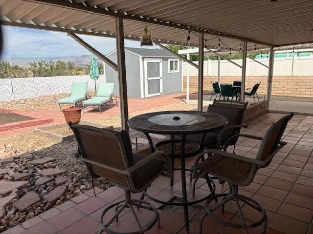 a view of an outdoor dining space with furniture