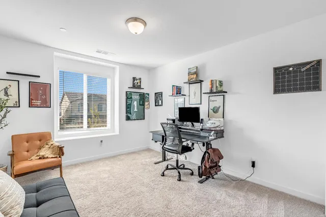 a workspace with furniture and a window