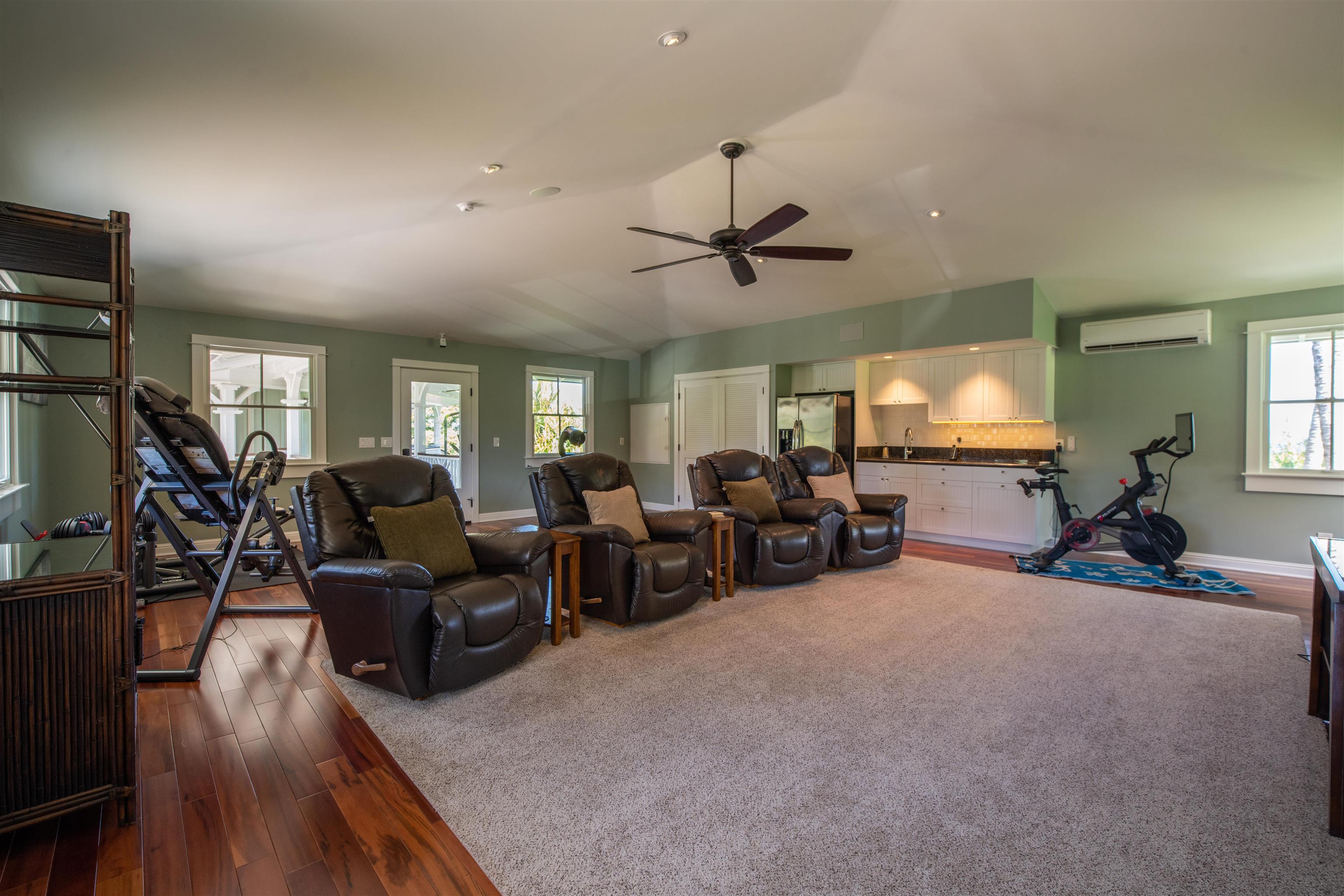 65 North Holokai Road Haiku, HI 96708 - Photo 28 of 50 a living room with furniture kitchen view and a flat screen tv