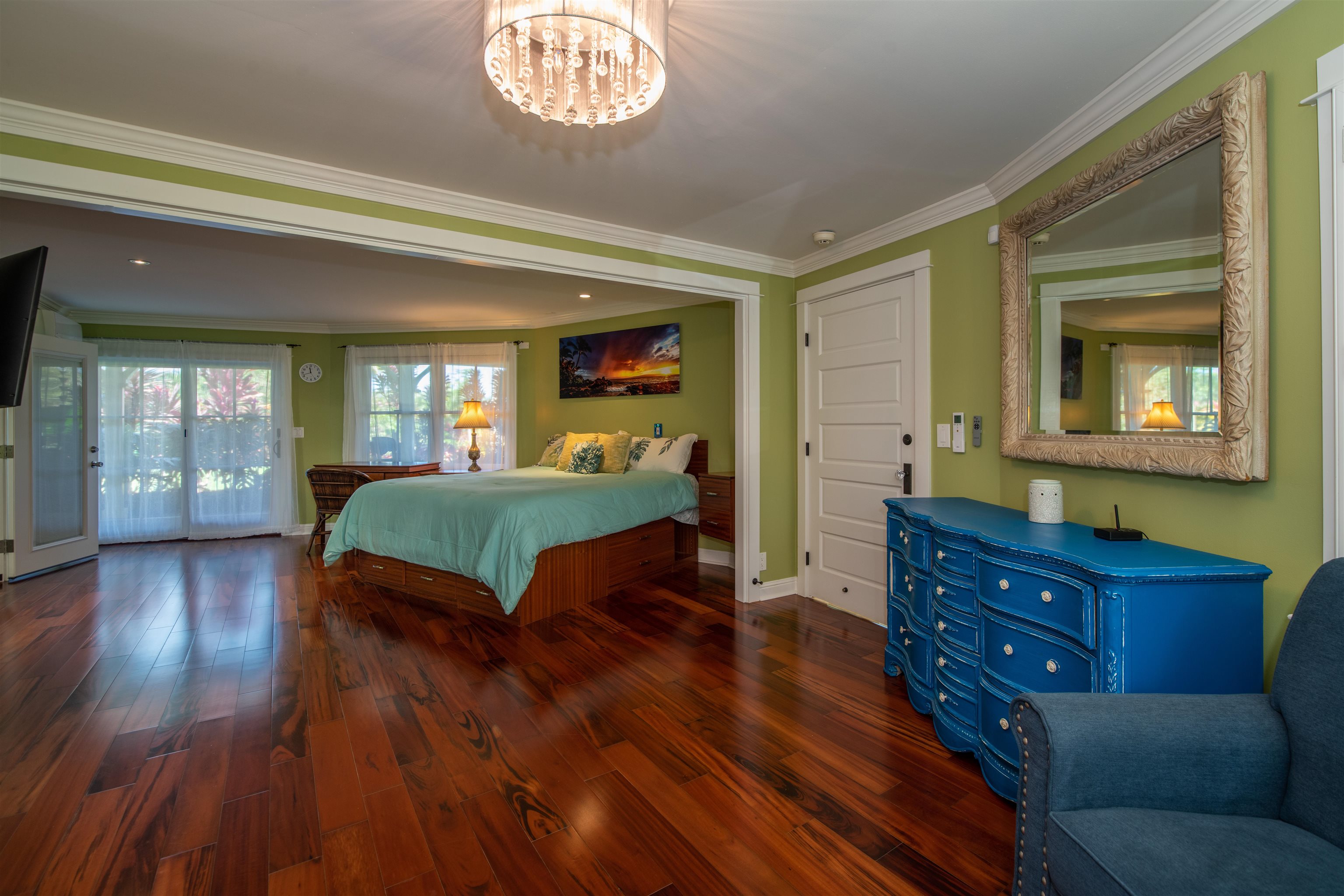 65 North Holokai Road Haiku, HI 96708 - Photo 40 of 50 a bedroom with a bed and wooden floor