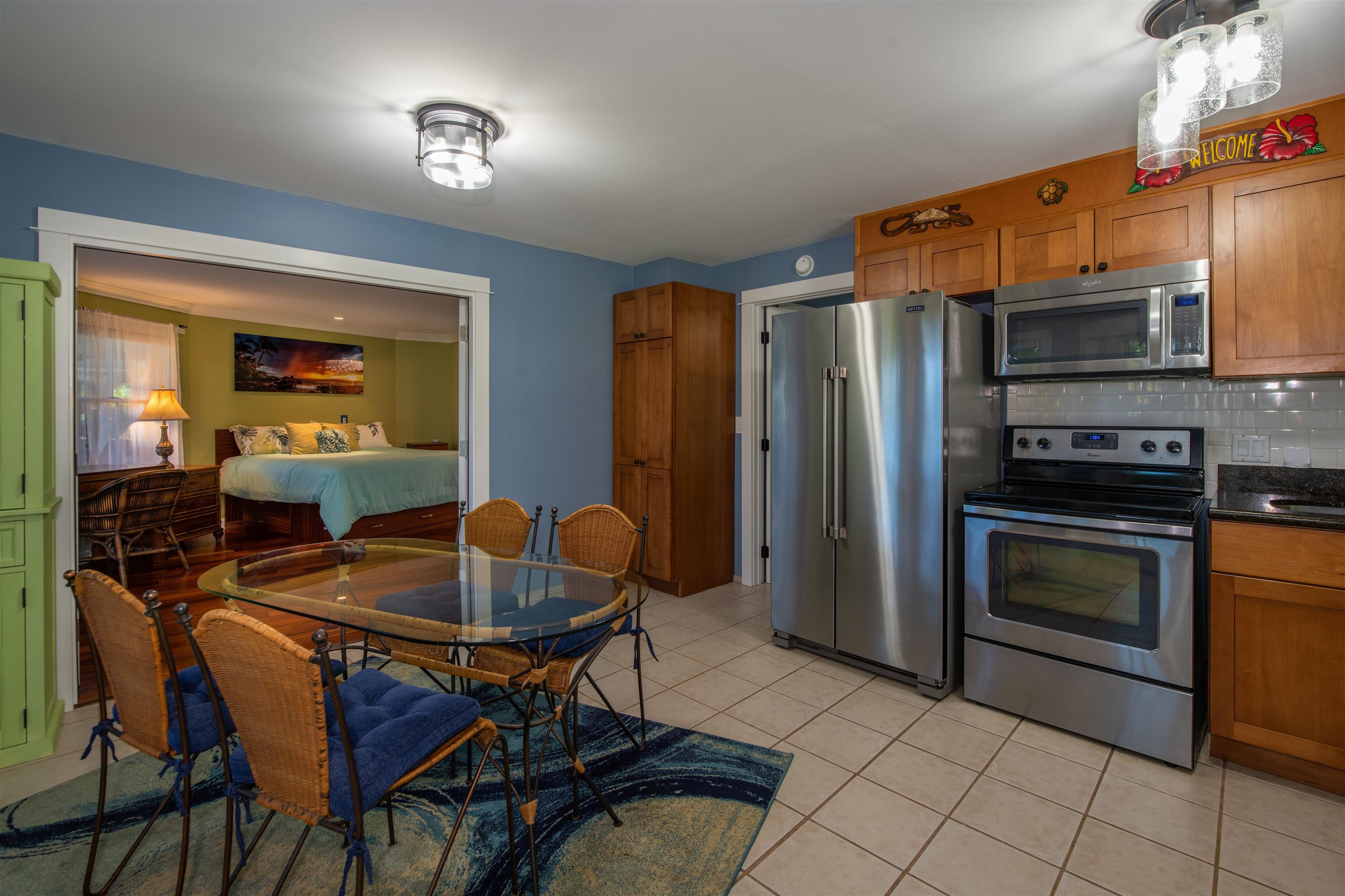 65 North Holokai Road Haiku, HI 96708 - Photo 42 of 50 a kitchen with stainless steel appliances a stove a sink and a refrigerator