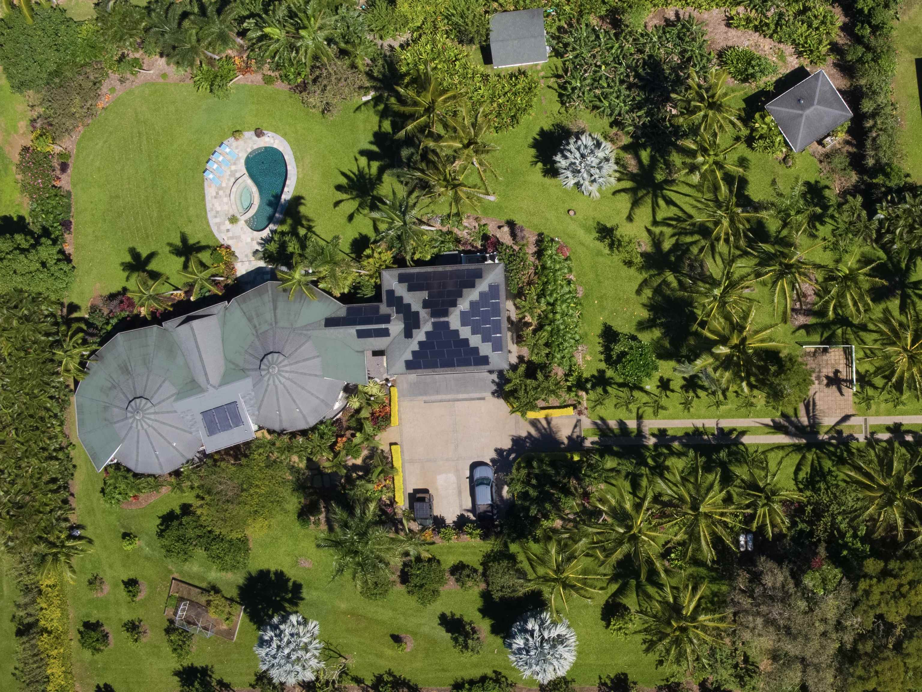 65 North Holokai Road Haiku, HI 96708 - Photo 46 of 50 an aerial view of a house with a yard and swimming pool