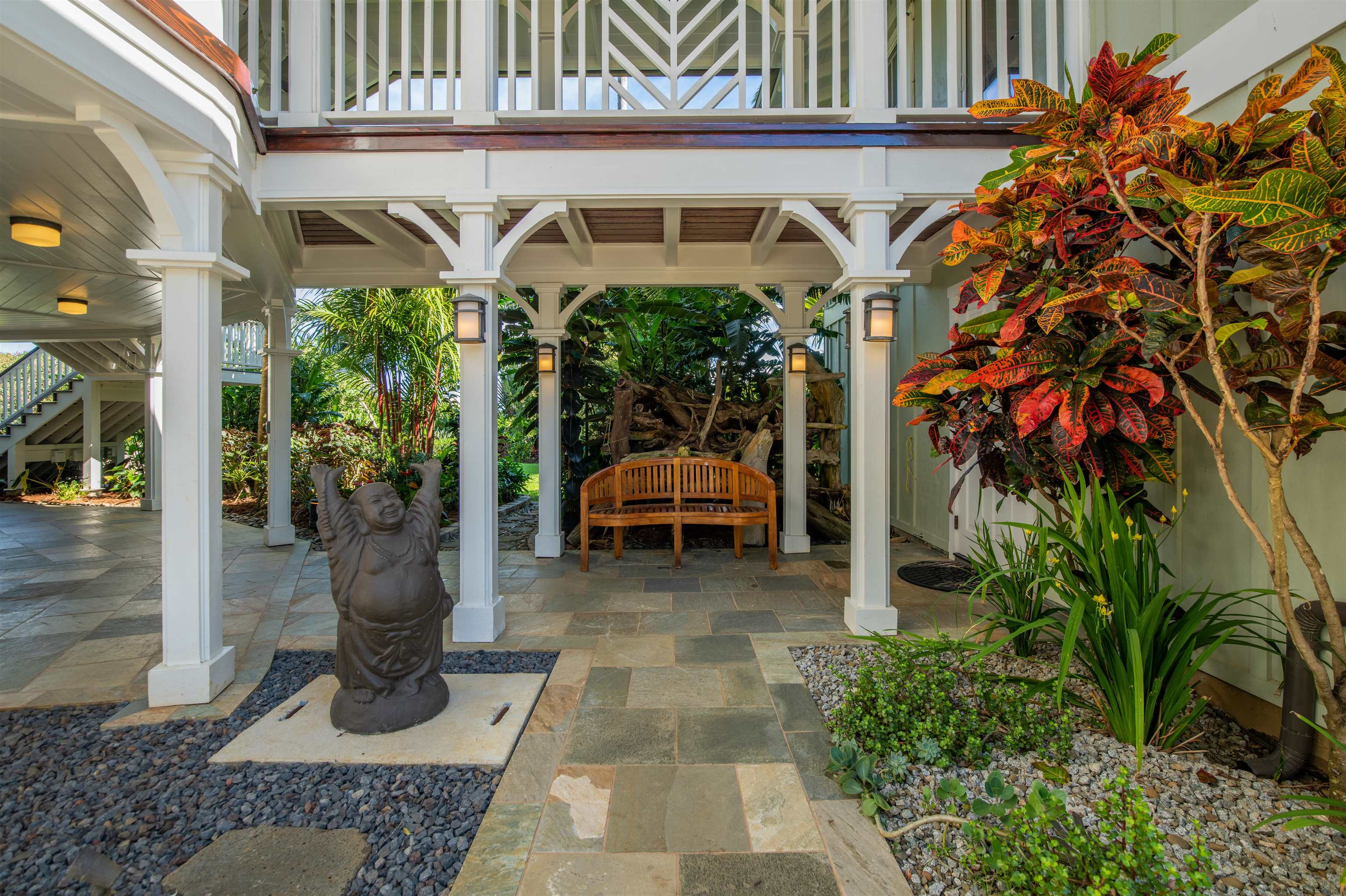 65 North Holokai Road Haiku, HI 96708 - Photo 5 of 50 a view of a patio with table and chairs potted plants