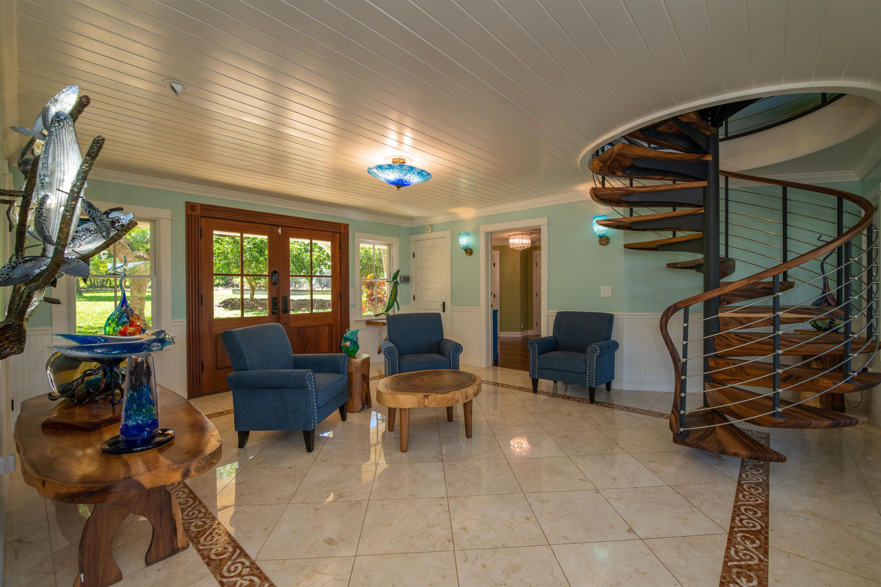 65 North Holokai Road Haiku, HI 96708 - Photo 6 of 50 a living room with furniture a fireplace and a flat screen tv
