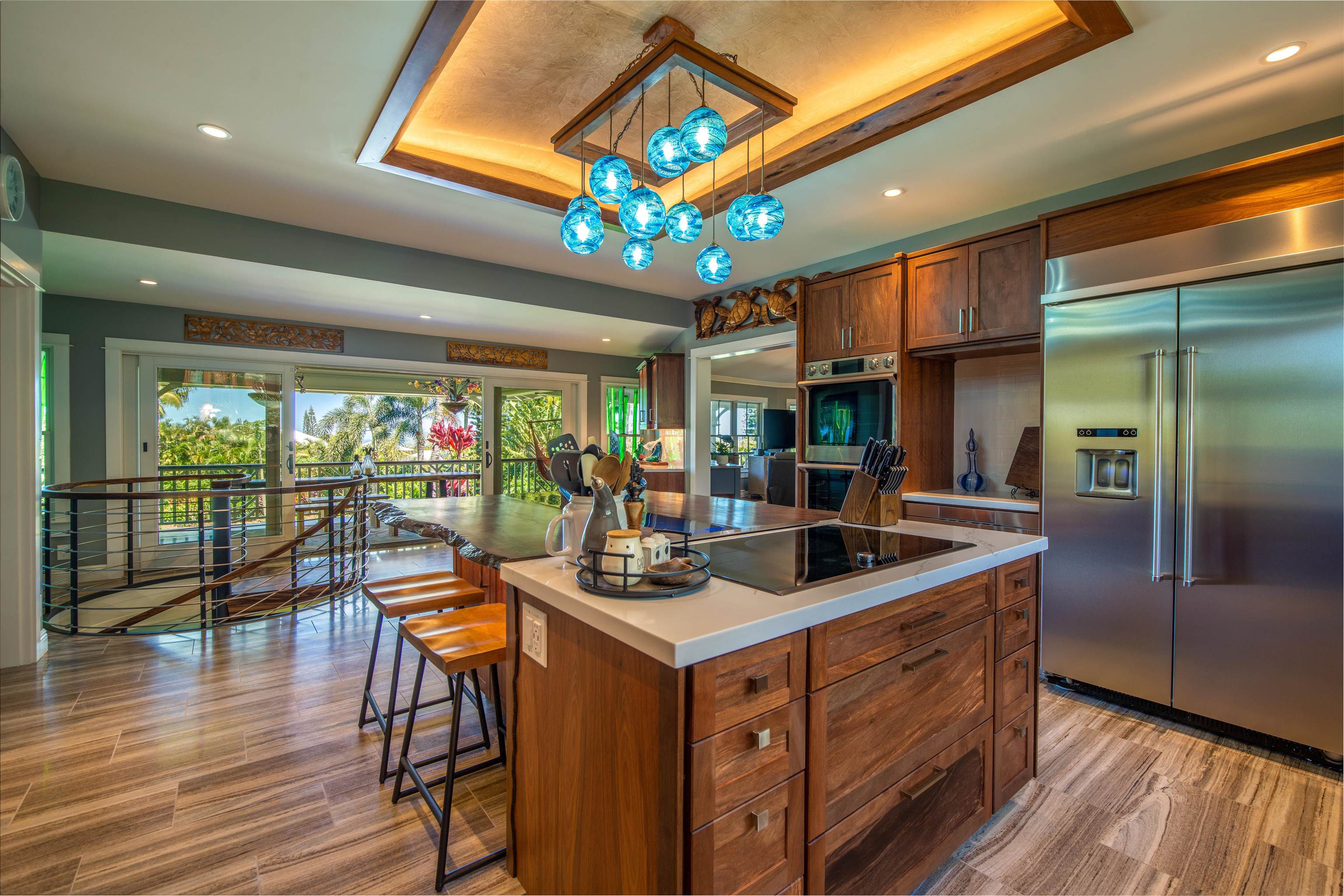 65 North Holokai Road Haiku, HI 96708 - Photo 8 of 50 a kitchen with stainless steel appliances granite countertop a stove and a refrigerator