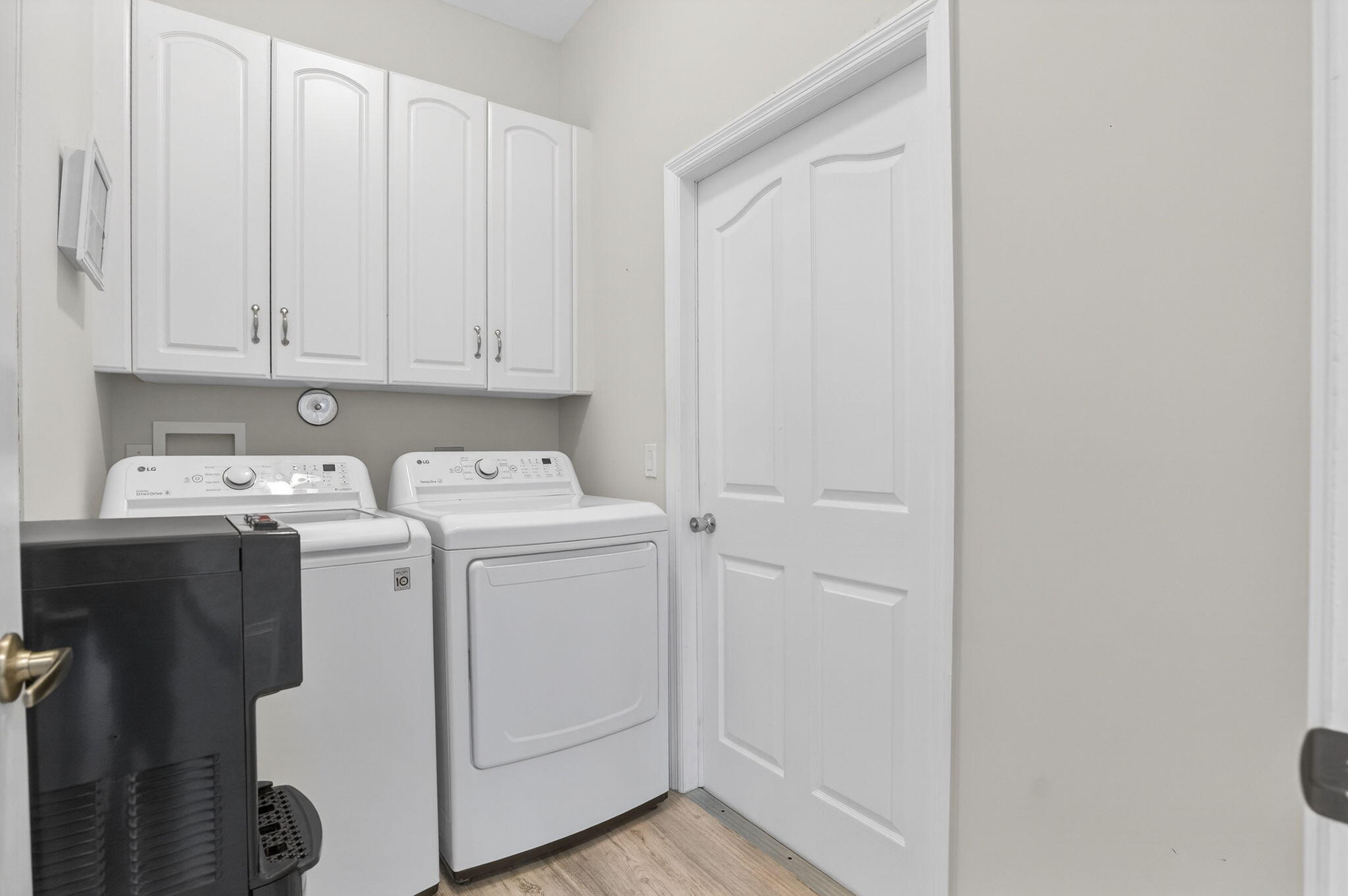 9275 Southeast Mercury Street Hobe Sound, FL 33455 - Photo 16 of 65 a utility room with dryer and washer