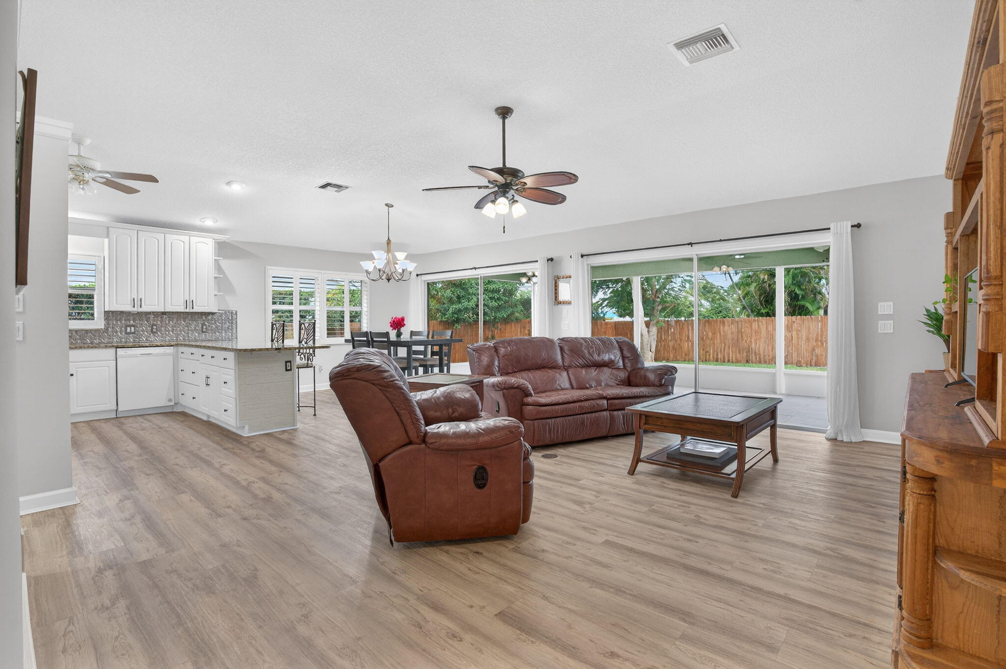 9275 Southeast Mercury Street Hobe Sound, FL 33455 - Photo 17 of 65 a living room with furniture and a large window