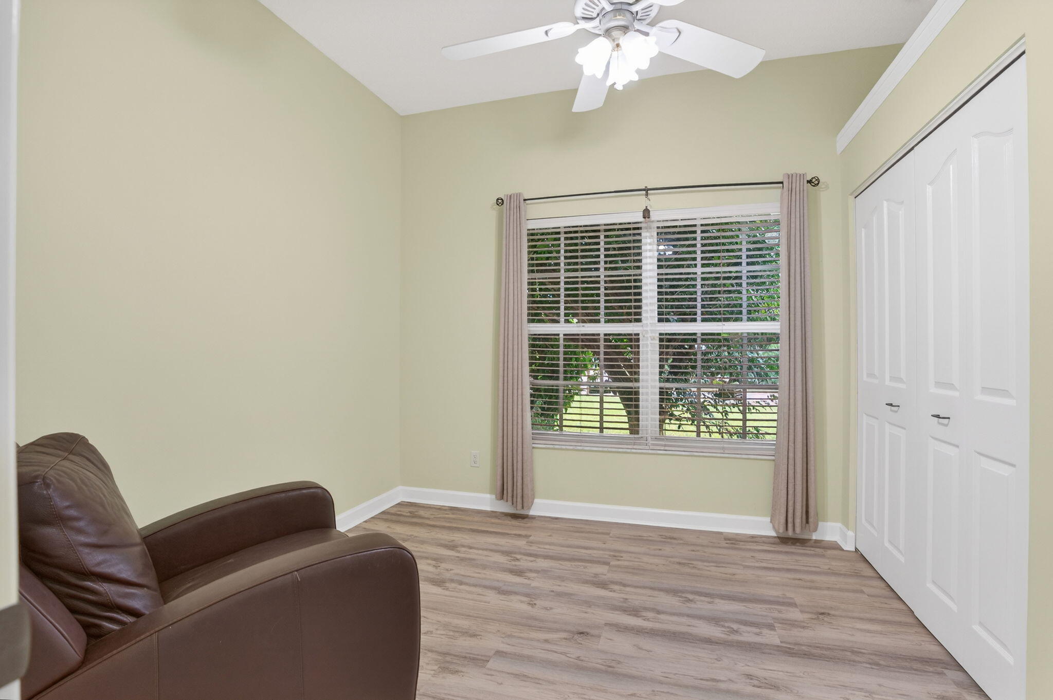 9275 Southeast Mercury Street Hobe Sound, FL 33455 - Photo 30 of 65 a living room with furniture and a window