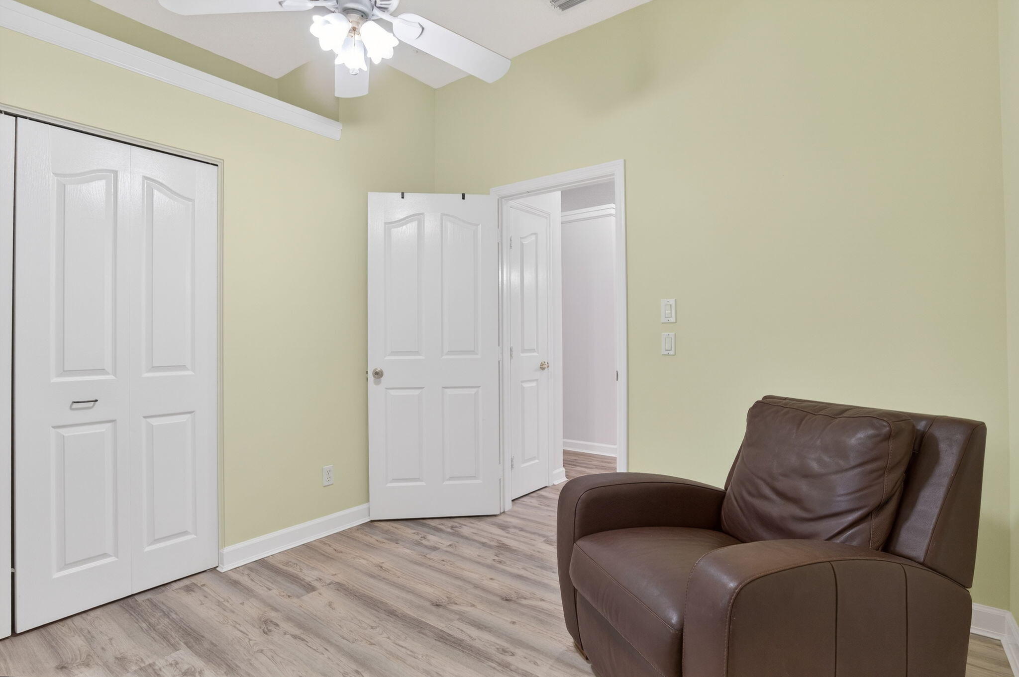 9275 Southeast Mercury Street Hobe Sound, FL 33455 - Photo 31 of 65 a living room with furniture and a chandelier