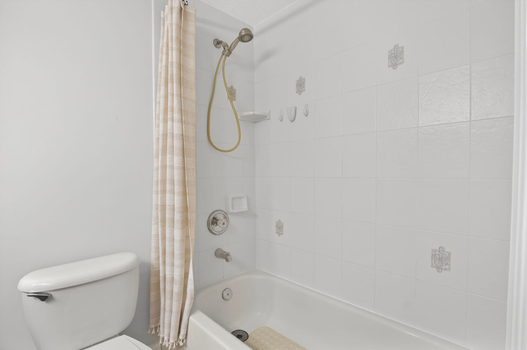 9275 Southeast Mercury Street Hobe Sound, FL 33455 - Photo 33 of 65 a bathroom with a shower a toilet and a shower