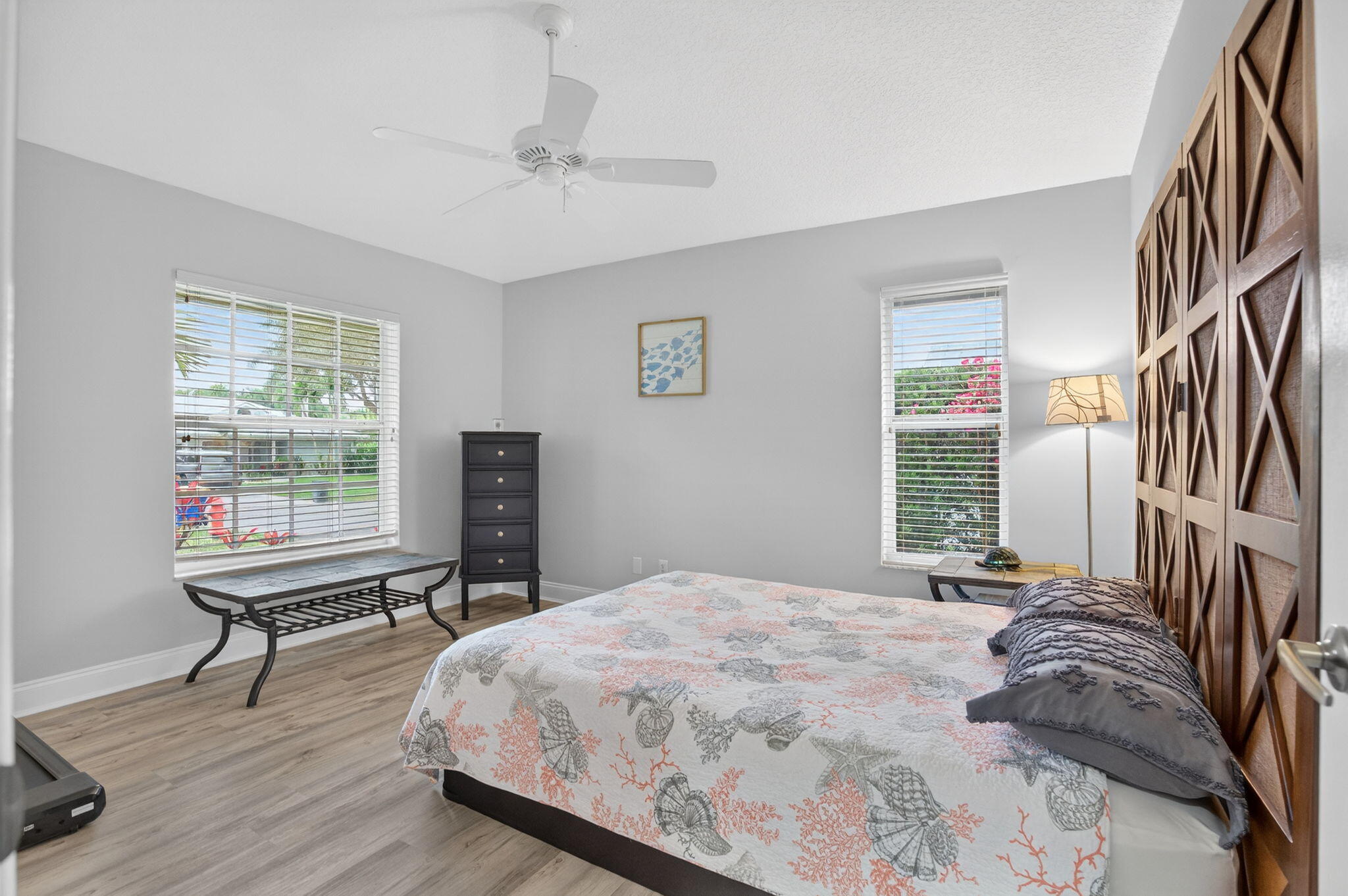 9275 Southeast Mercury Street Hobe Sound, FL 33455 - Photo 34 of 65 a bedroom with a bed and a window