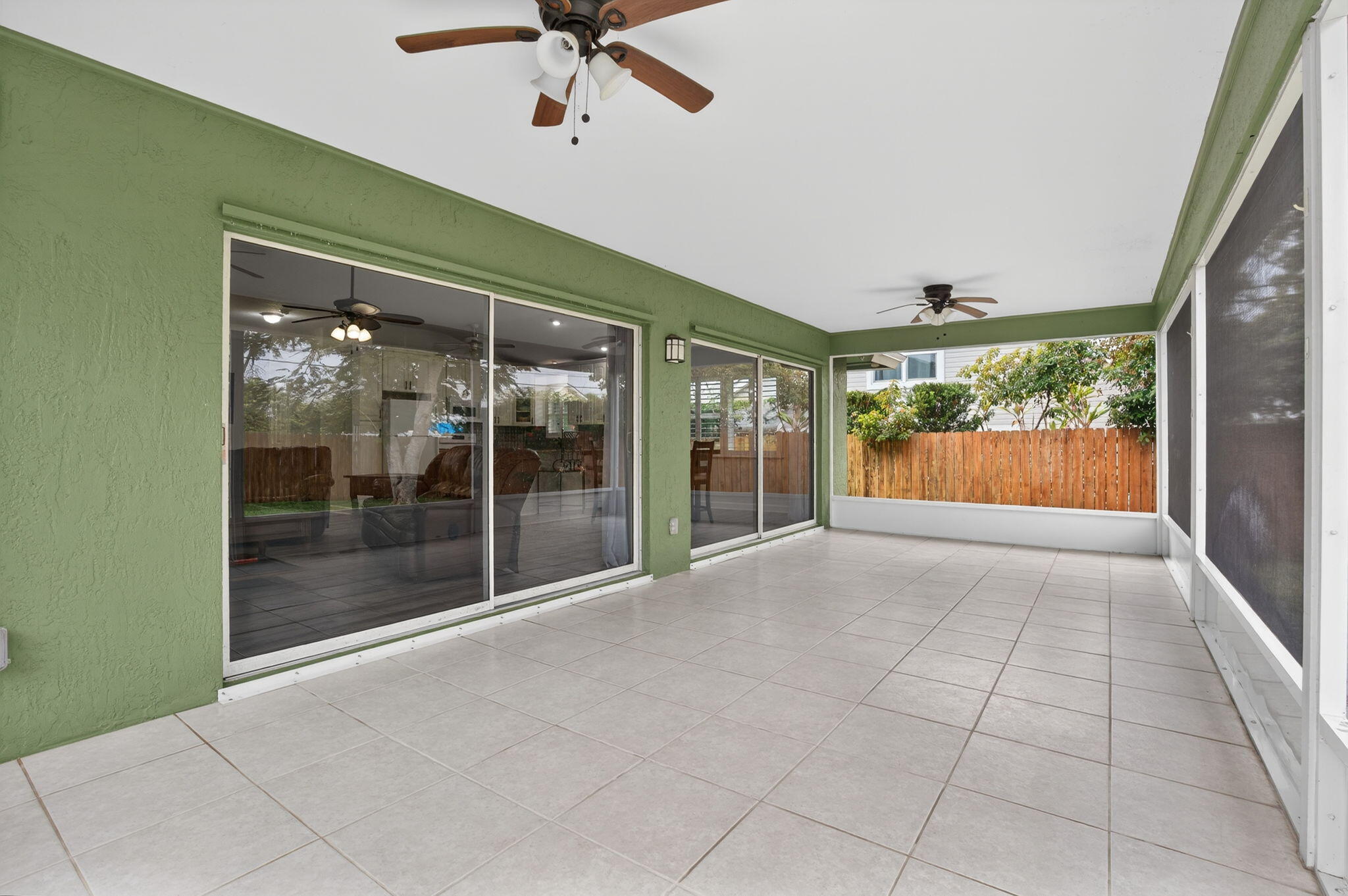 9275 Southeast Mercury Street Hobe Sound, FL 33455 - Photo 37 of 65 a view of an empty room with sliding glass door