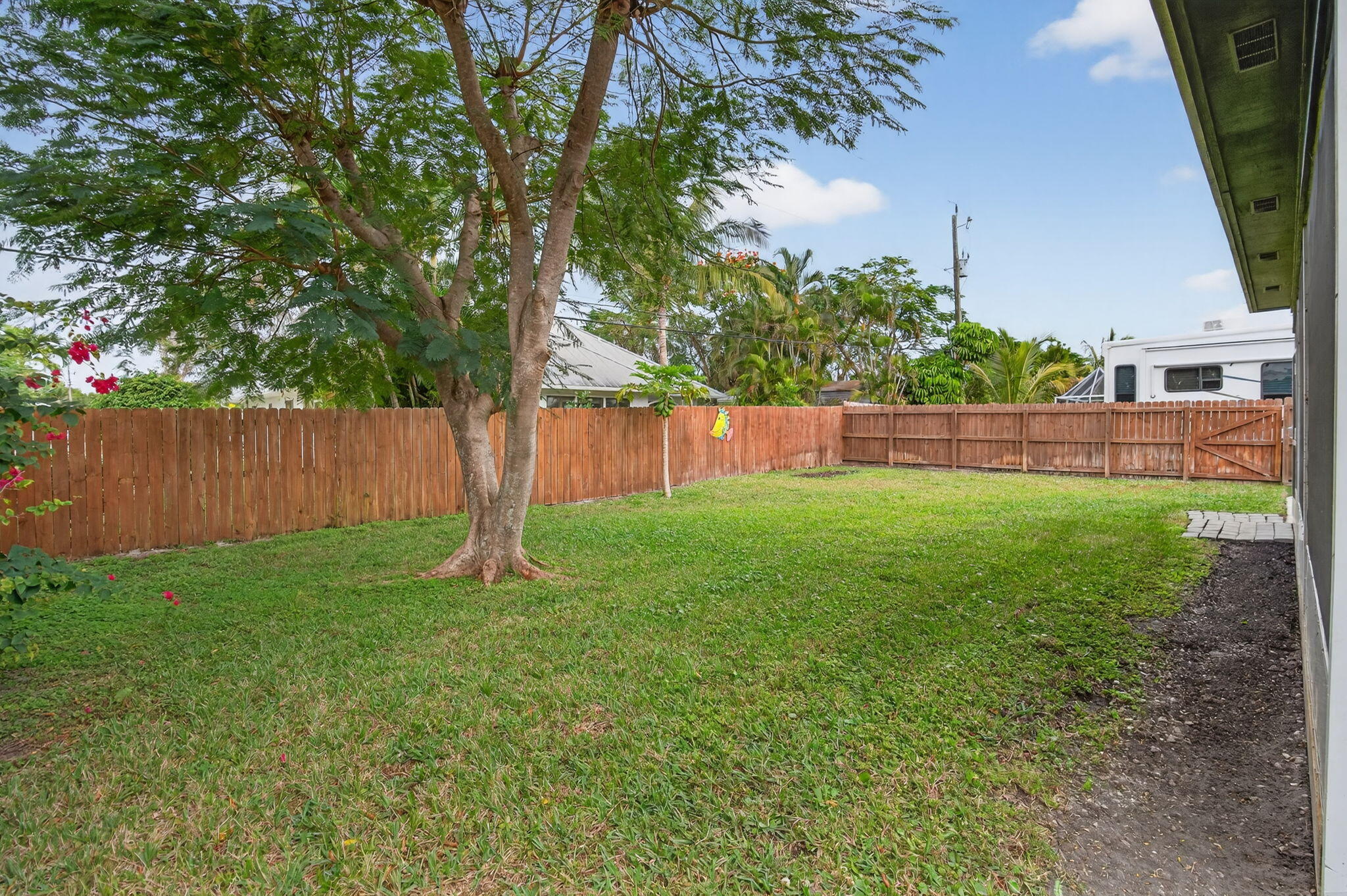 9275 Southeast Mercury Street Hobe Sound, FL 33455 - Photo 47 of 65 a fire hydrant in the middle of a yard