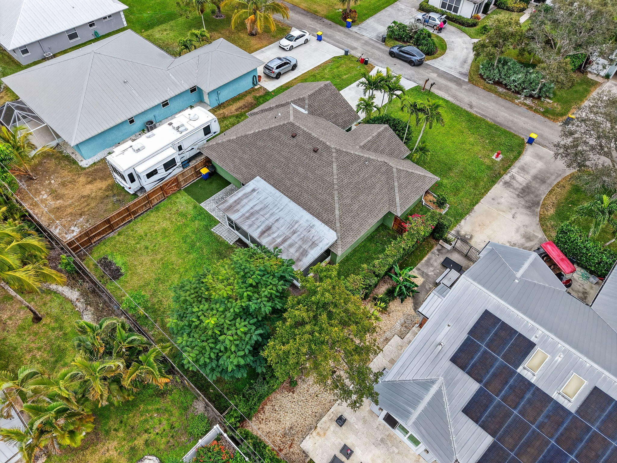 9275 Southeast Mercury Street Hobe Sound, FL 33455 - Photo 53 of 65 an aerial view of a house with a garden