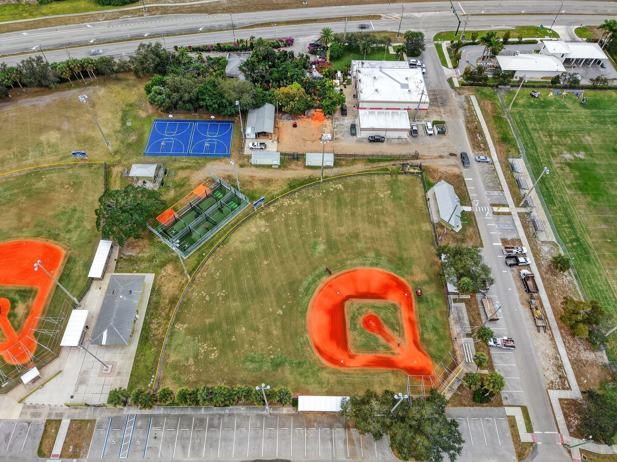 9275 Southeast Mercury Street Hobe Sound, FL 33455 - Photo 61 of 65 an aerial view of residential house with outdoor space and swimming pool