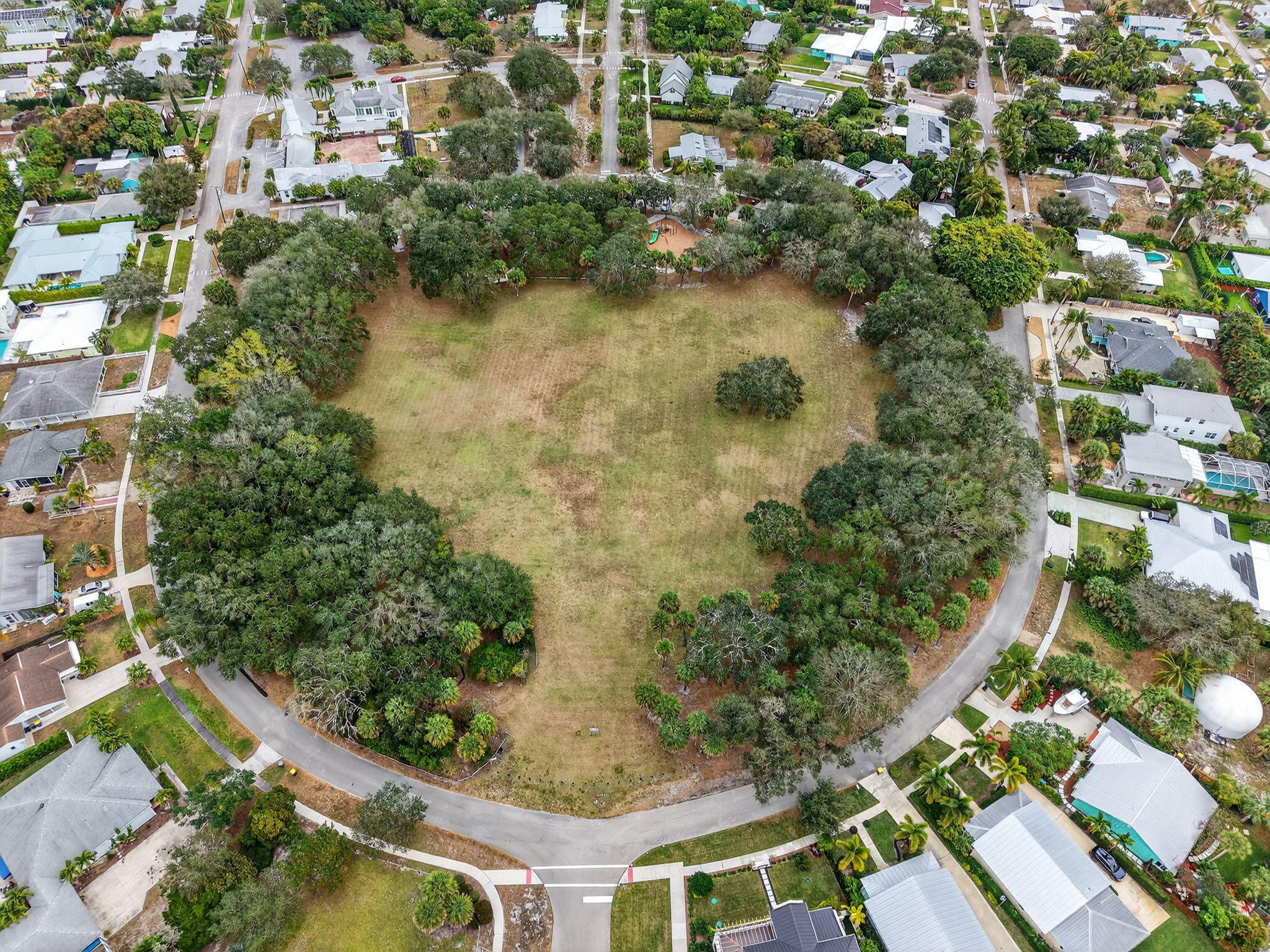 9275 Southeast Mercury Street Hobe Sound, FL 33455 - Photo 62 of 65 an aerial view of residential houses with outdoor space