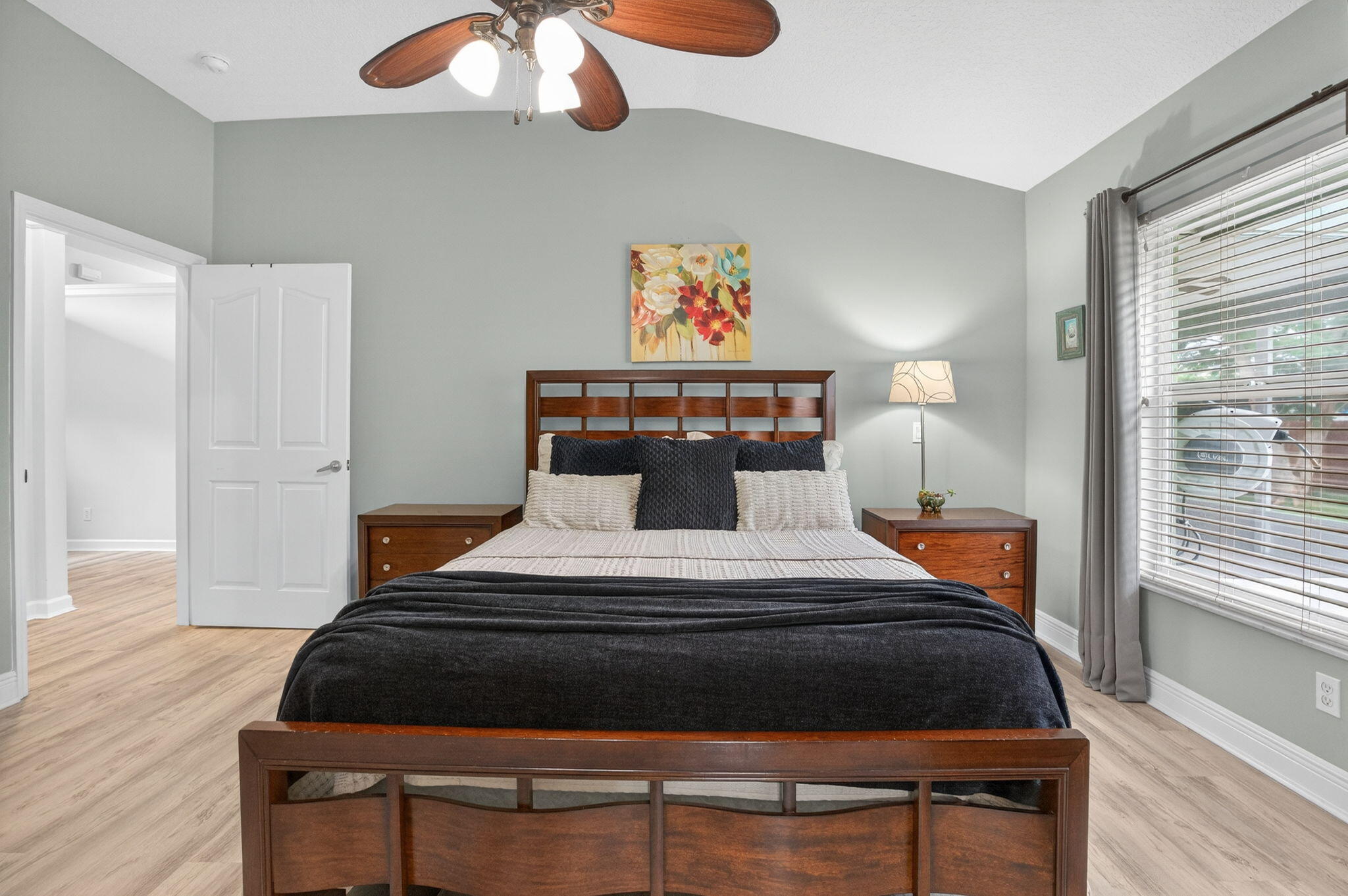 9275 Southeast Mercury Street Hobe Sound, FL 33455 - Photo 8 of 65 a bedroom with a bed and a window