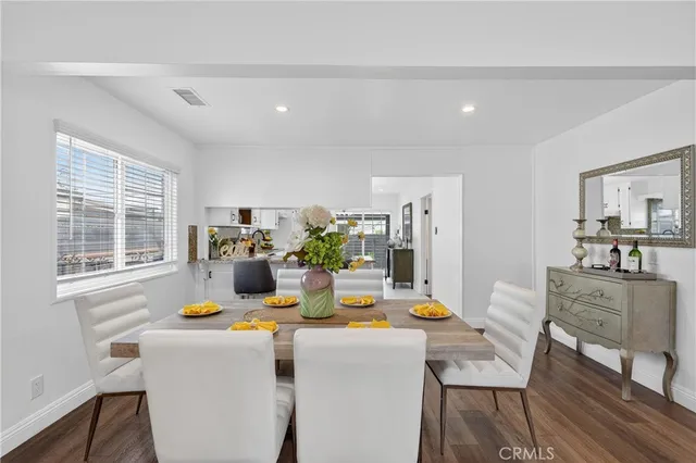 a view of a dining room with furniture and window