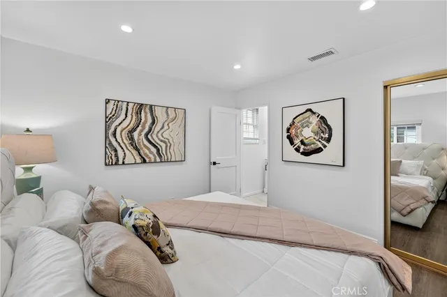 a view of a porch with furniture and floor to ceiling window