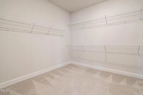 a view of a room with racks on the wall