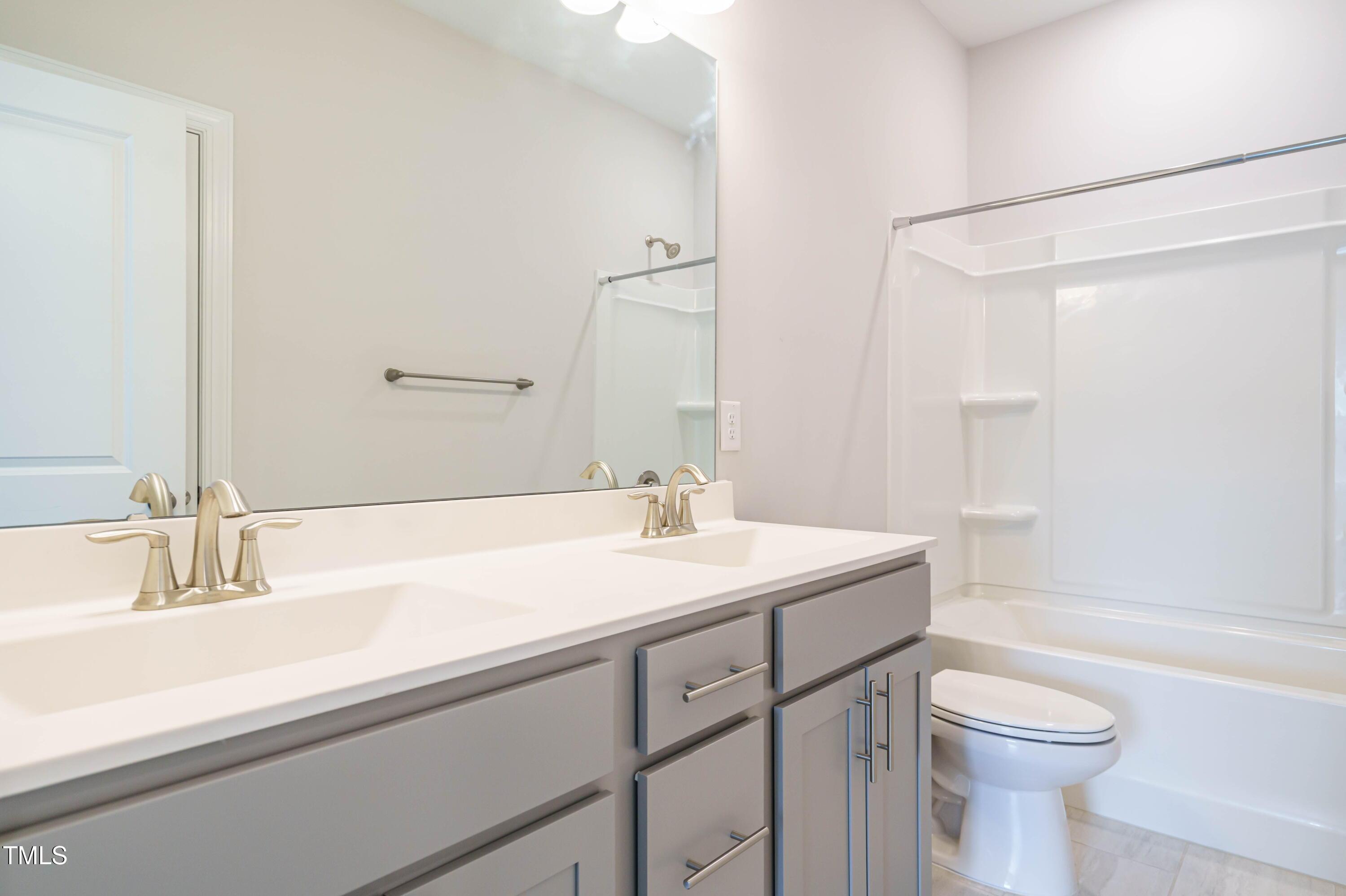 5201 Influence Way Raleigh, NC 27616 - Photo 29 of 33 a bathroom with a sink a toilet and shower