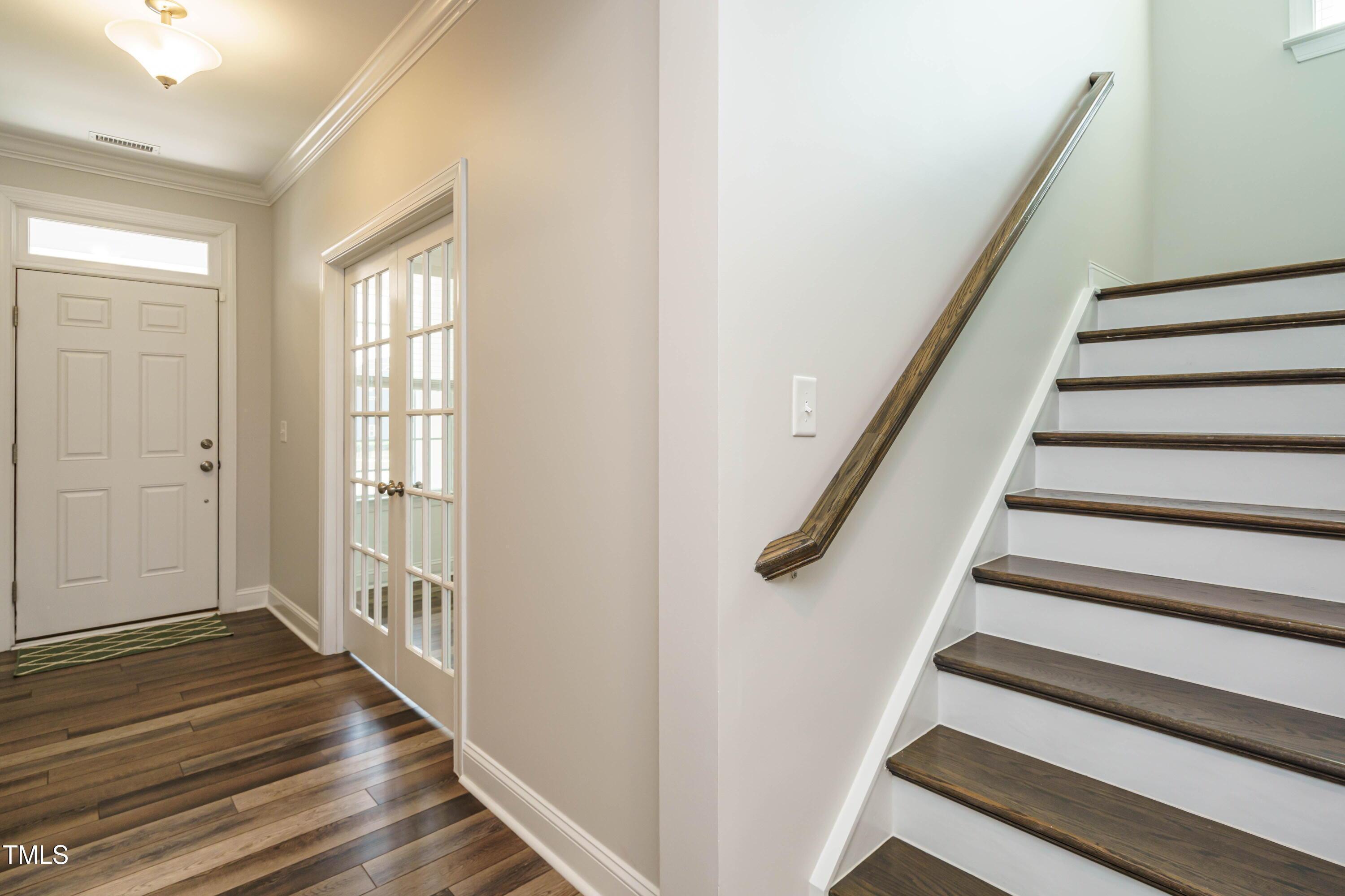 5201 Influence Way Raleigh, NC 27616 - Photo 3 of 33 a view of entryway with wooden floor and stairs