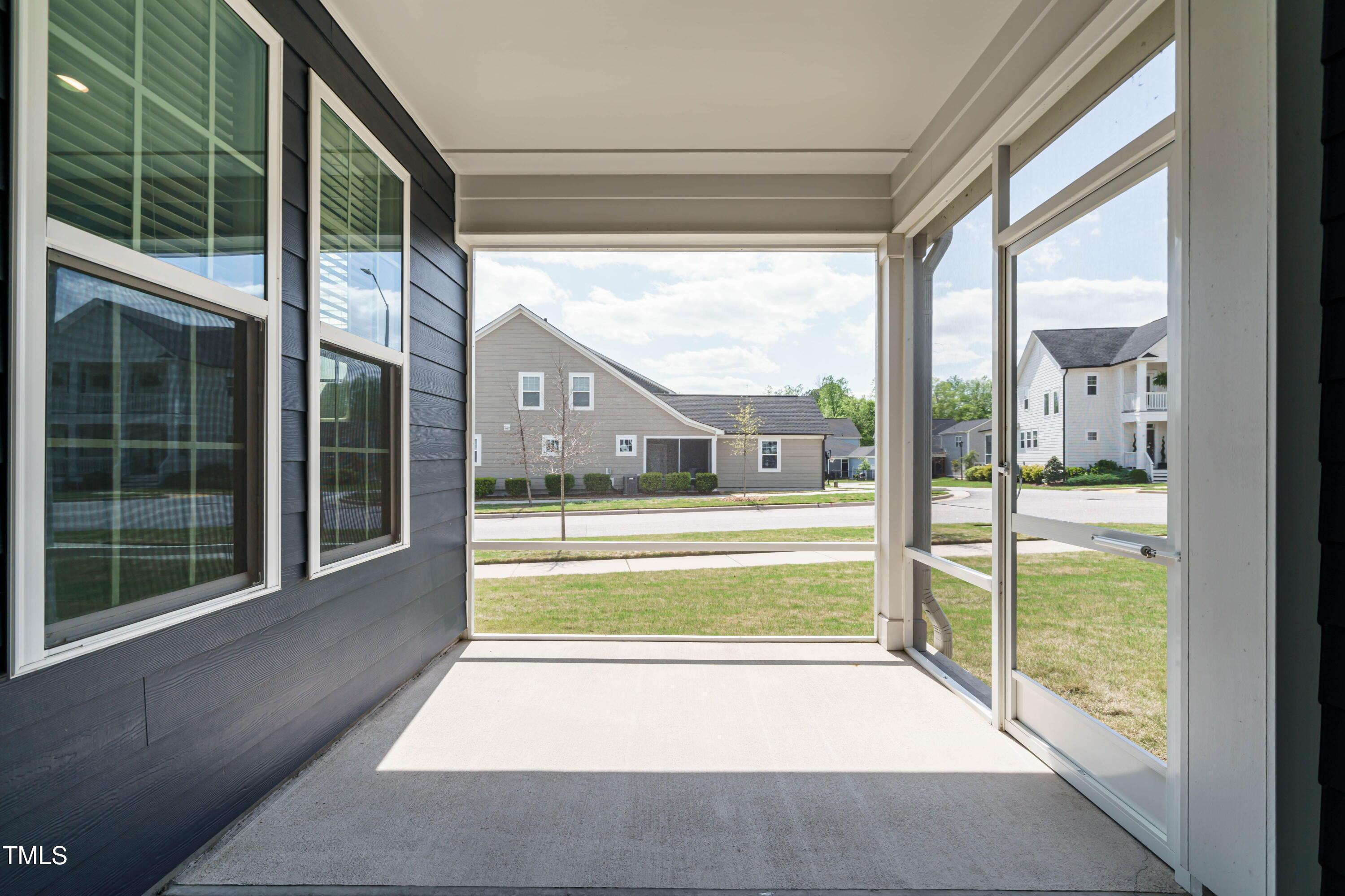 5201 Influence Way Raleigh, NC 27616 - Photo 31 of 33 a view of a glass door with a floor to ceiling window