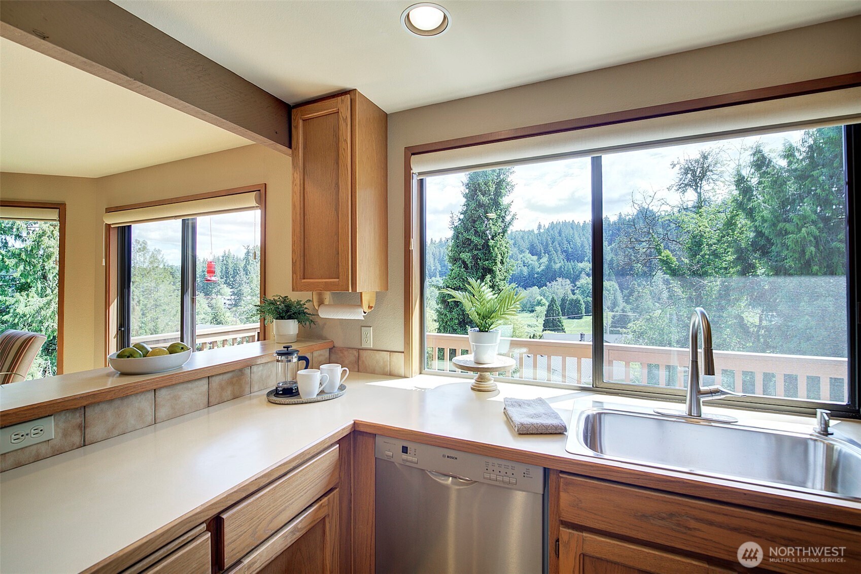 9430 Hoeder Lane Bothell, WA 98011 - Photo 12 of 39 a kitchen with a sink and large window