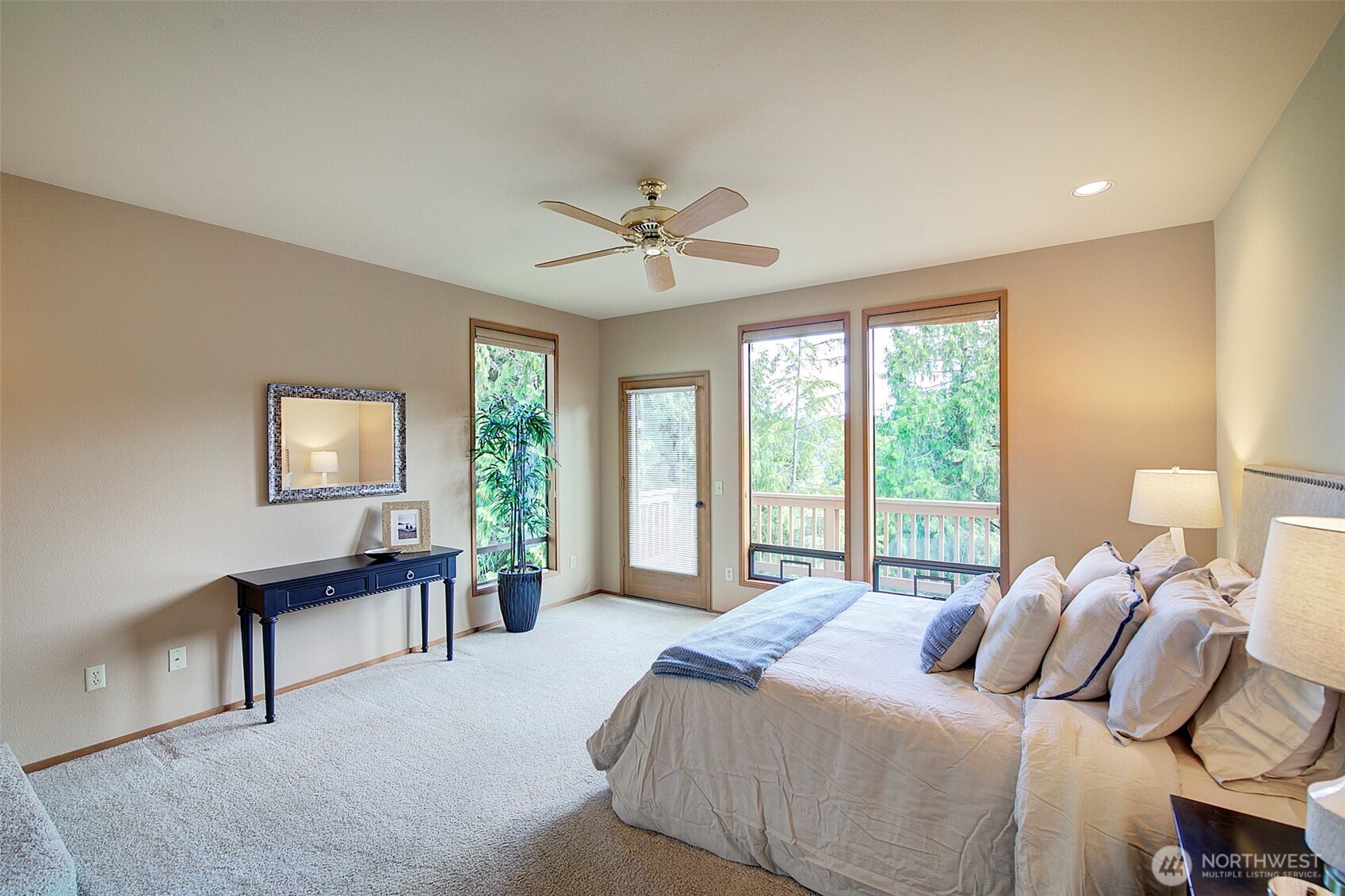 9430 Hoeder Lane Bothell, WA 98011 - Photo 14 of 39 a bedroom with a bed and a large window