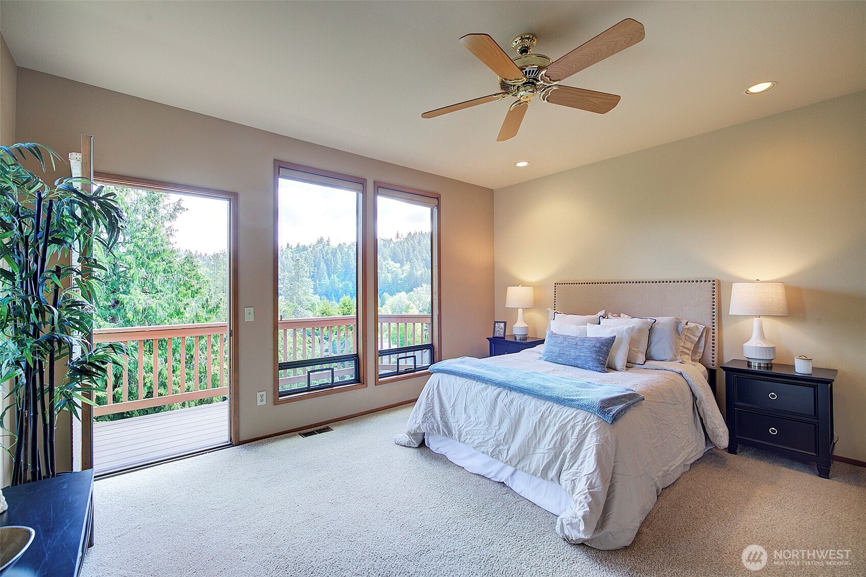 9430 Hoeder Lane Bothell, WA 98011 - Photo 15 of 39 a spacious bedroom with a bed and a large window
